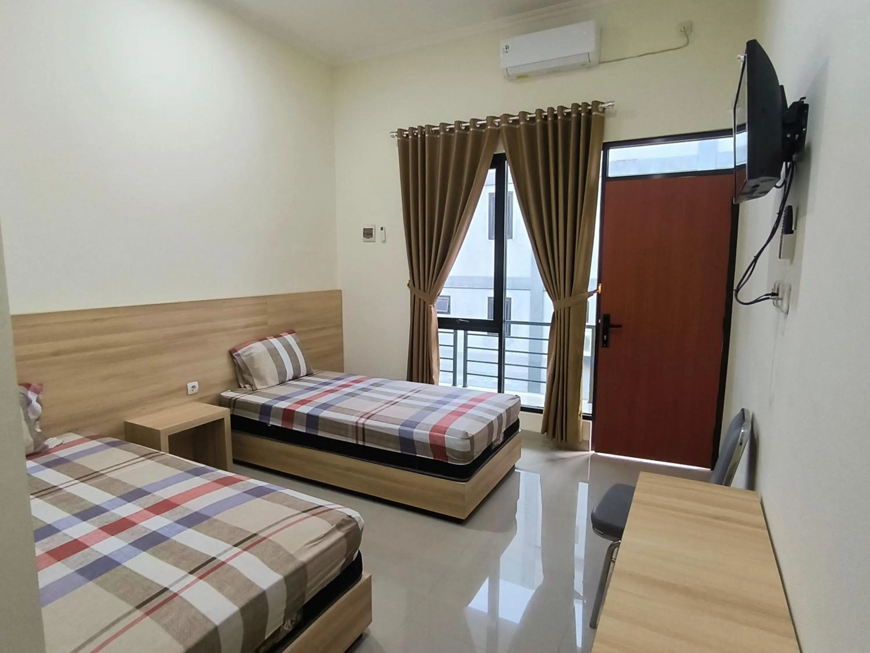 Bed in Tentrem Guesthouse Baru