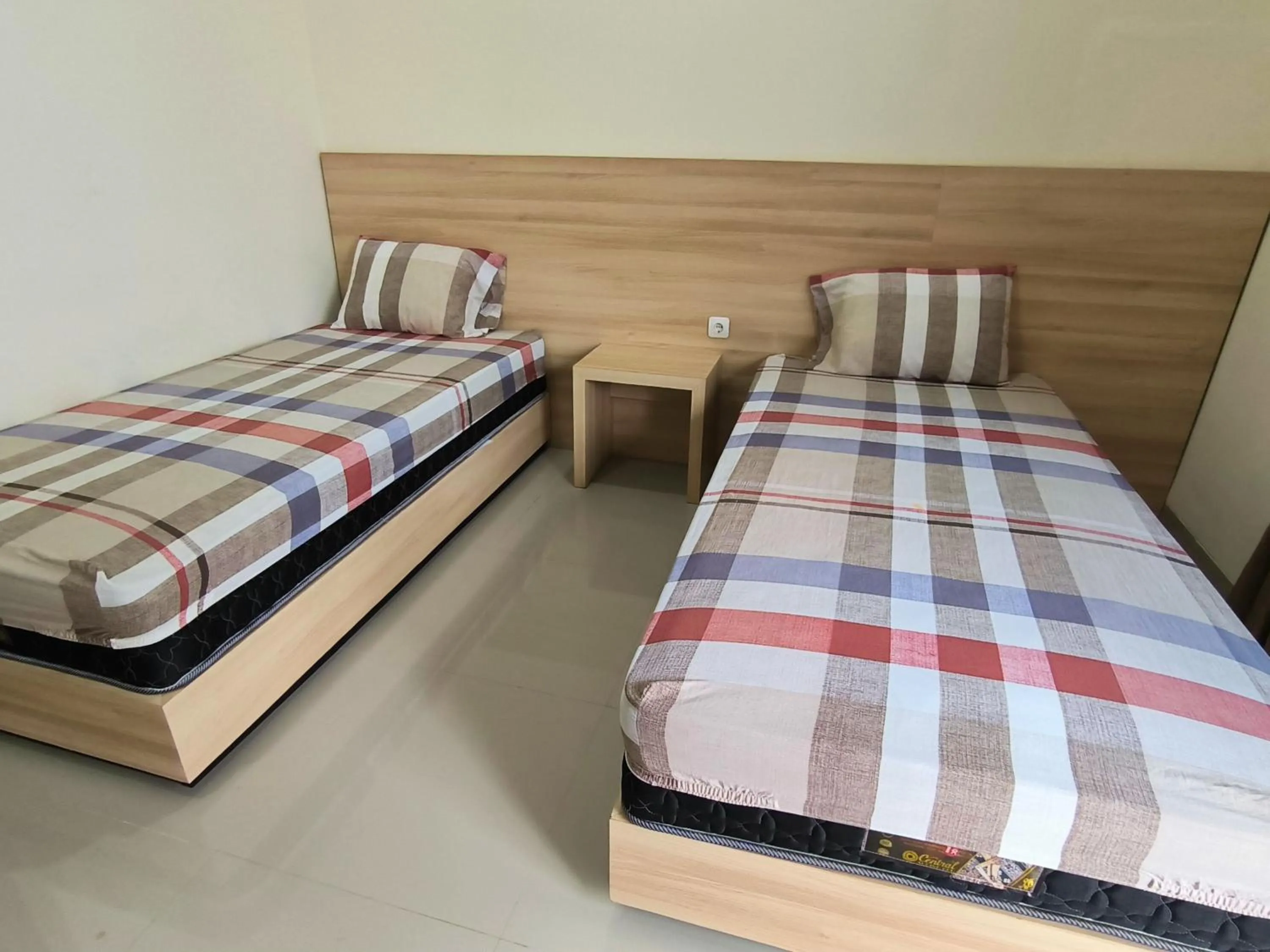 Bed in Tentrem Guesthouse Baru