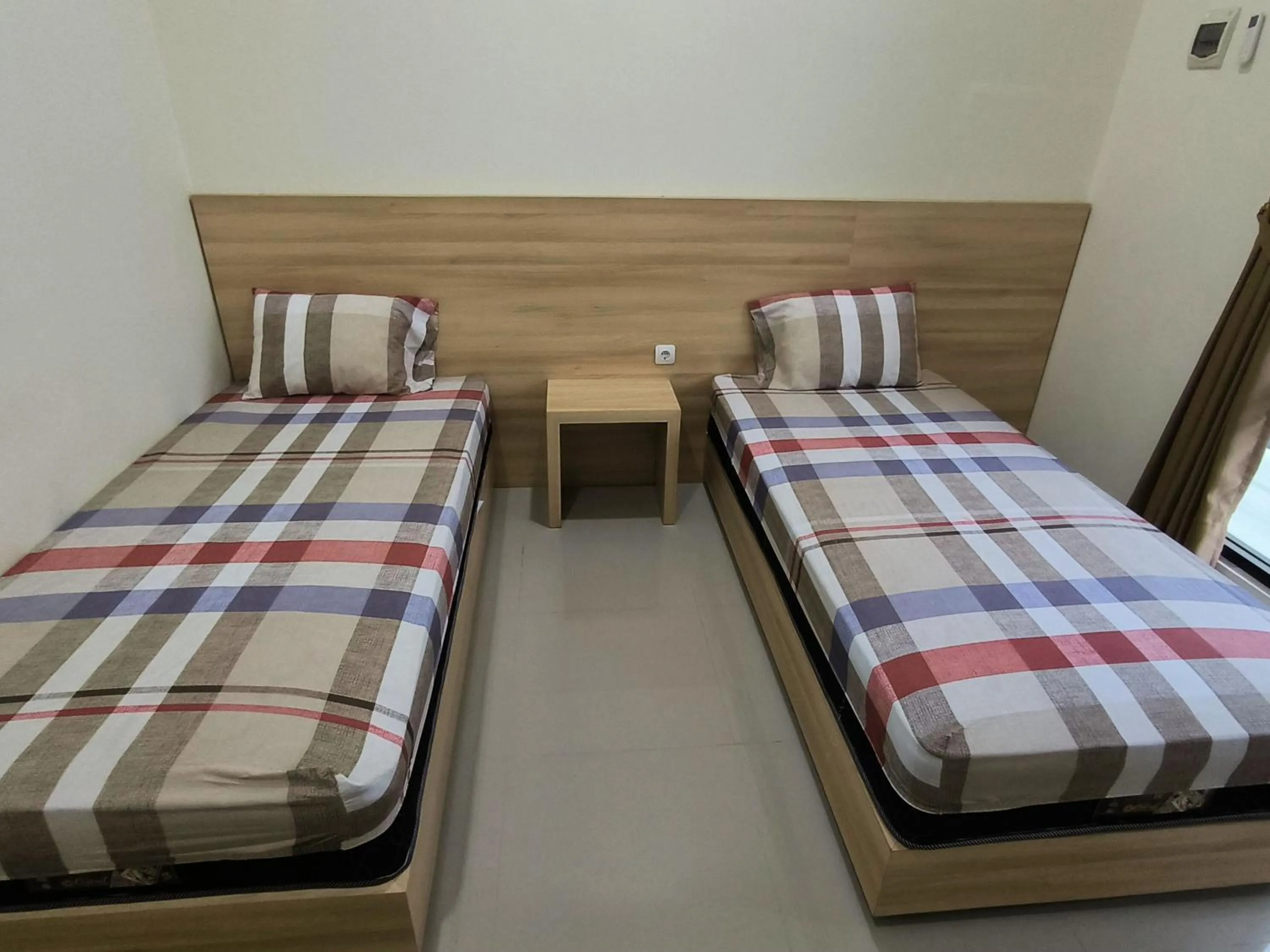Bed in Tentrem Guesthouse Baru
