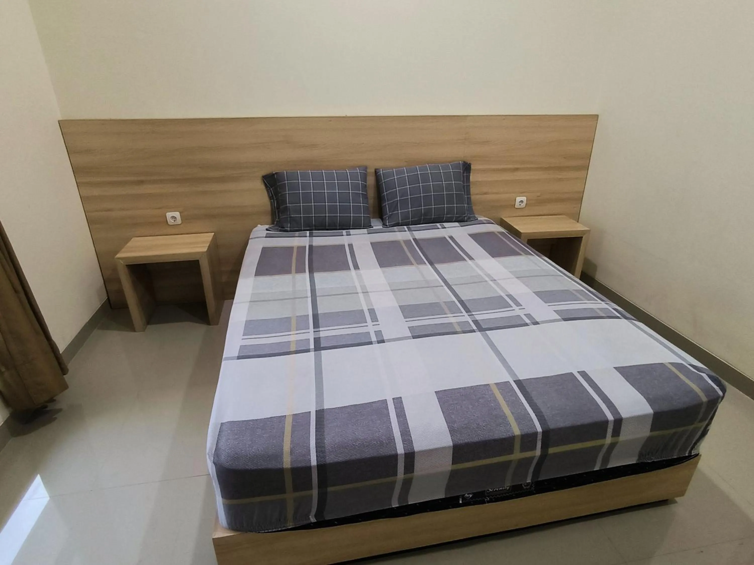 Bed in Tentrem Guesthouse Baru