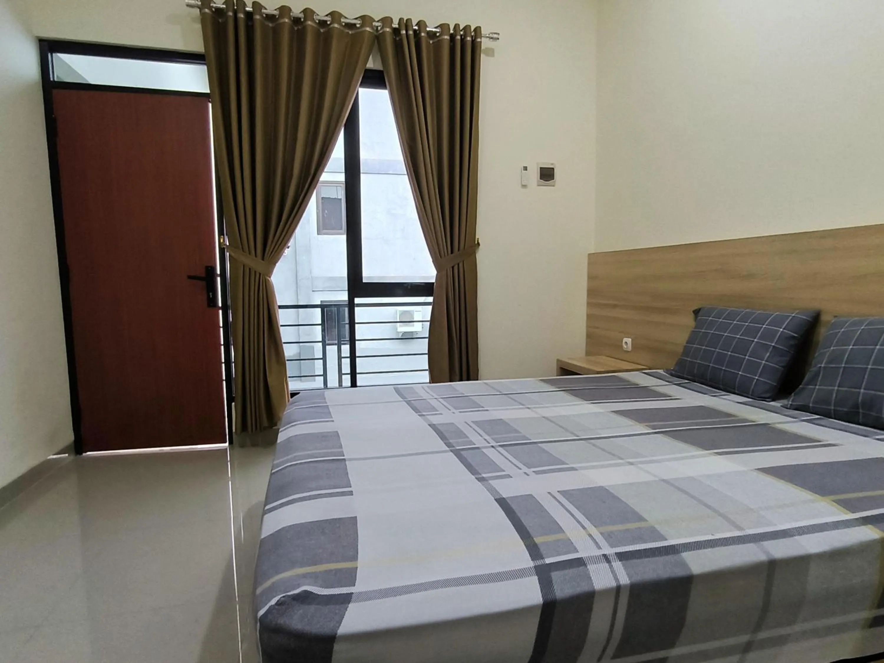 Bed in Tentrem Guesthouse Baru