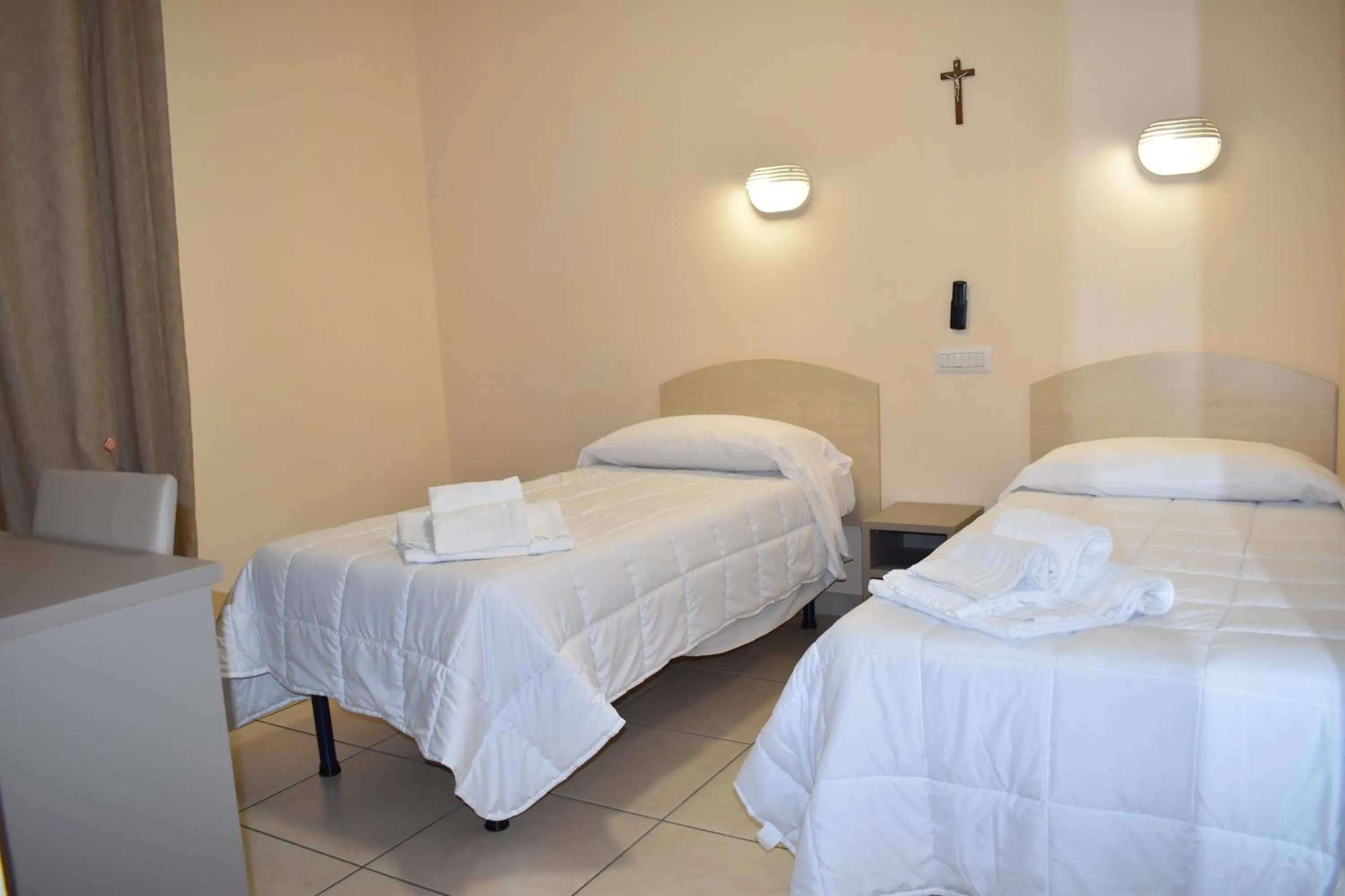 Bed in Pensione Piemonte Loreto