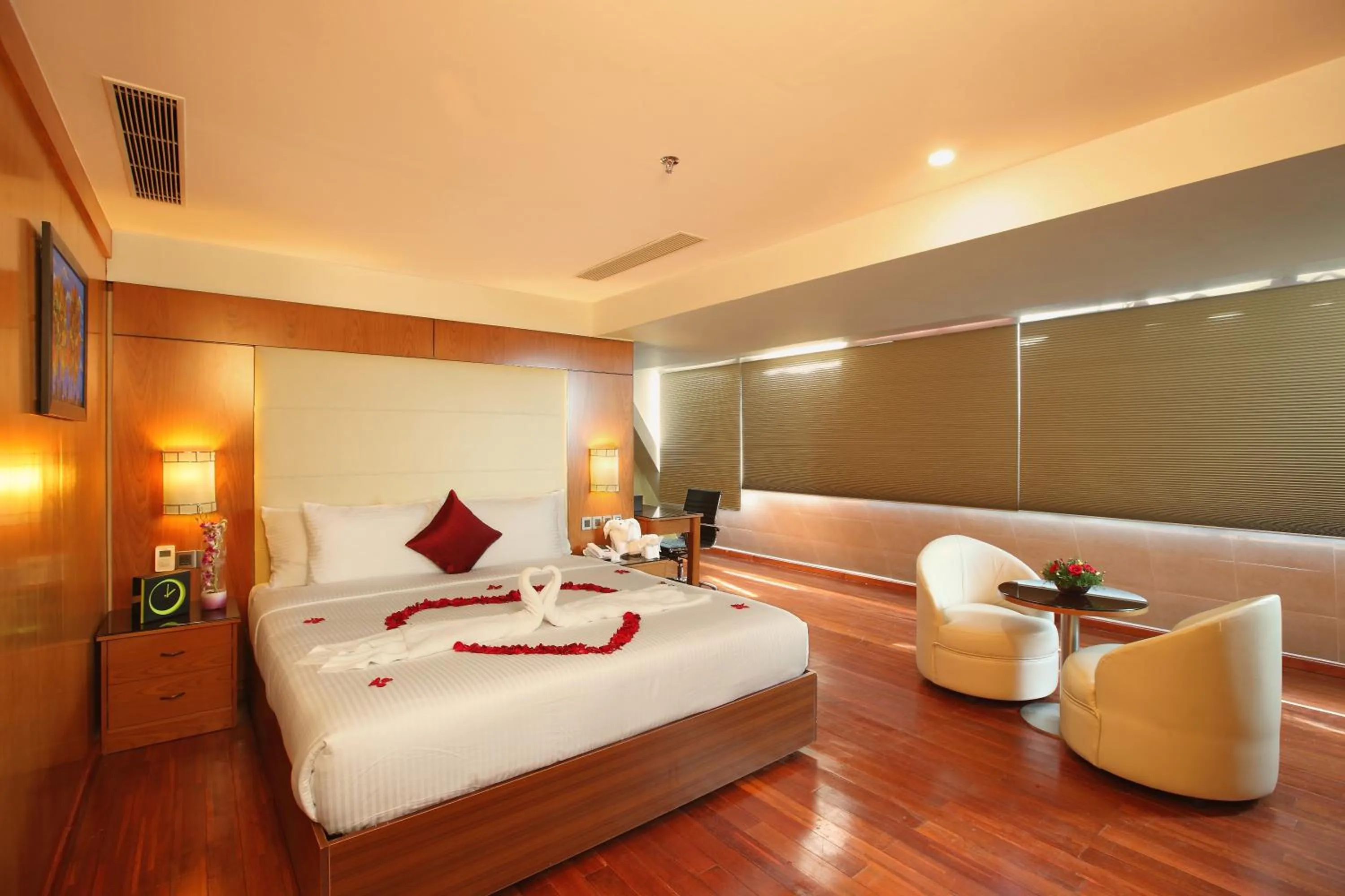 Bed in The Garuda Hotels