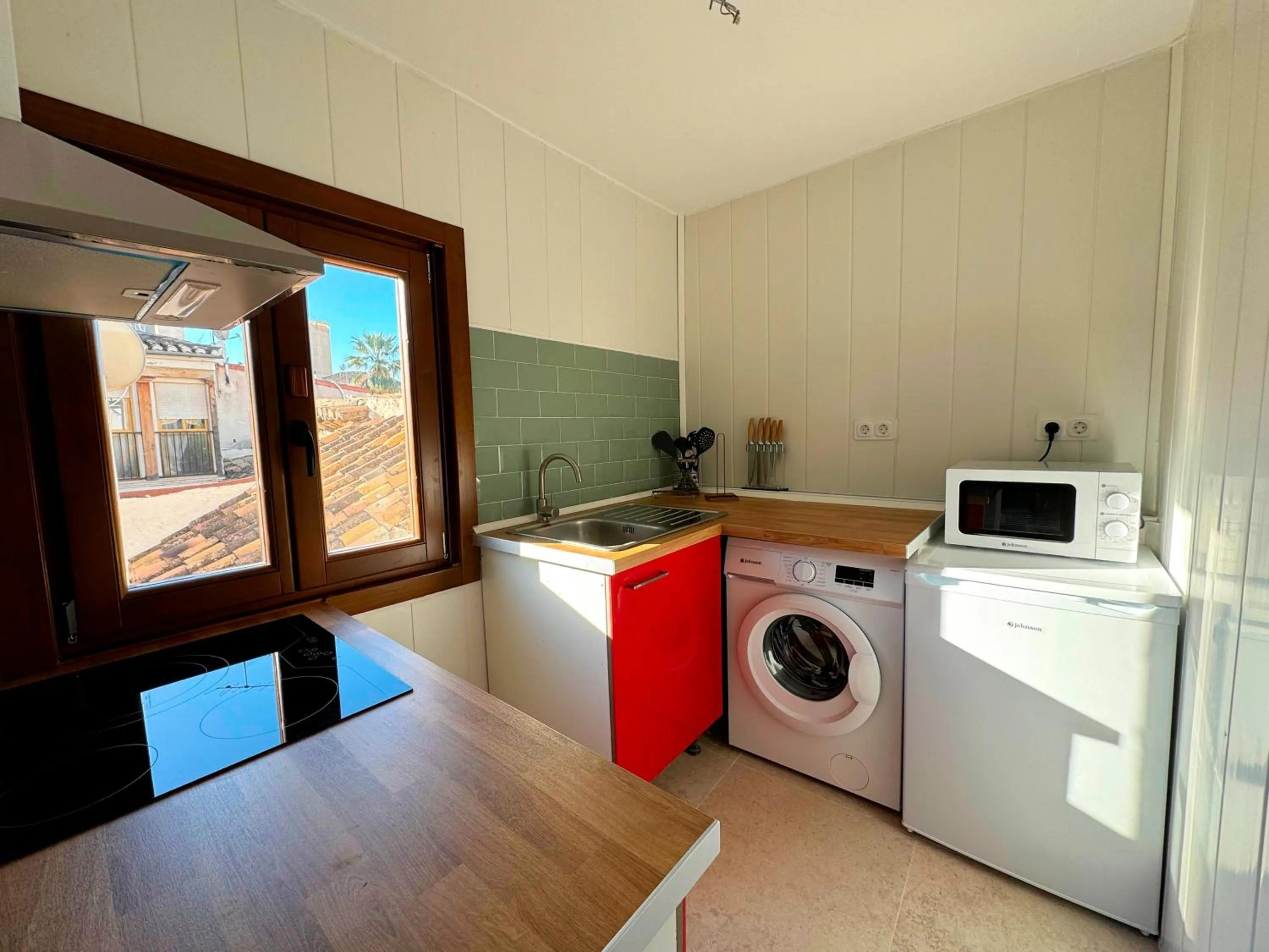 Kitchen or kitchenette in Apartamentos Plaza San Agustín 3000