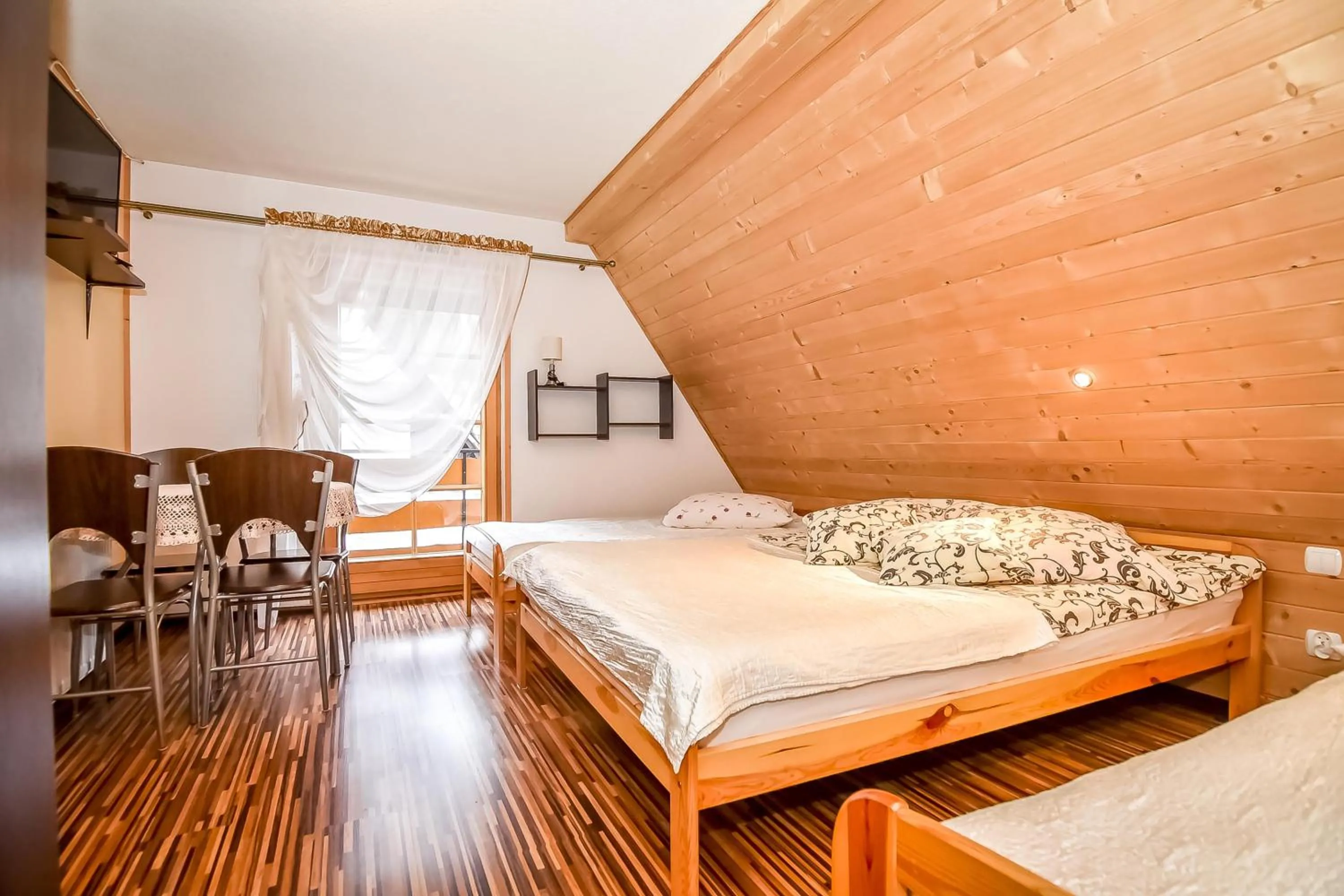 Bed in Ciukrowa Chatka Sauna & Jacuzzi
