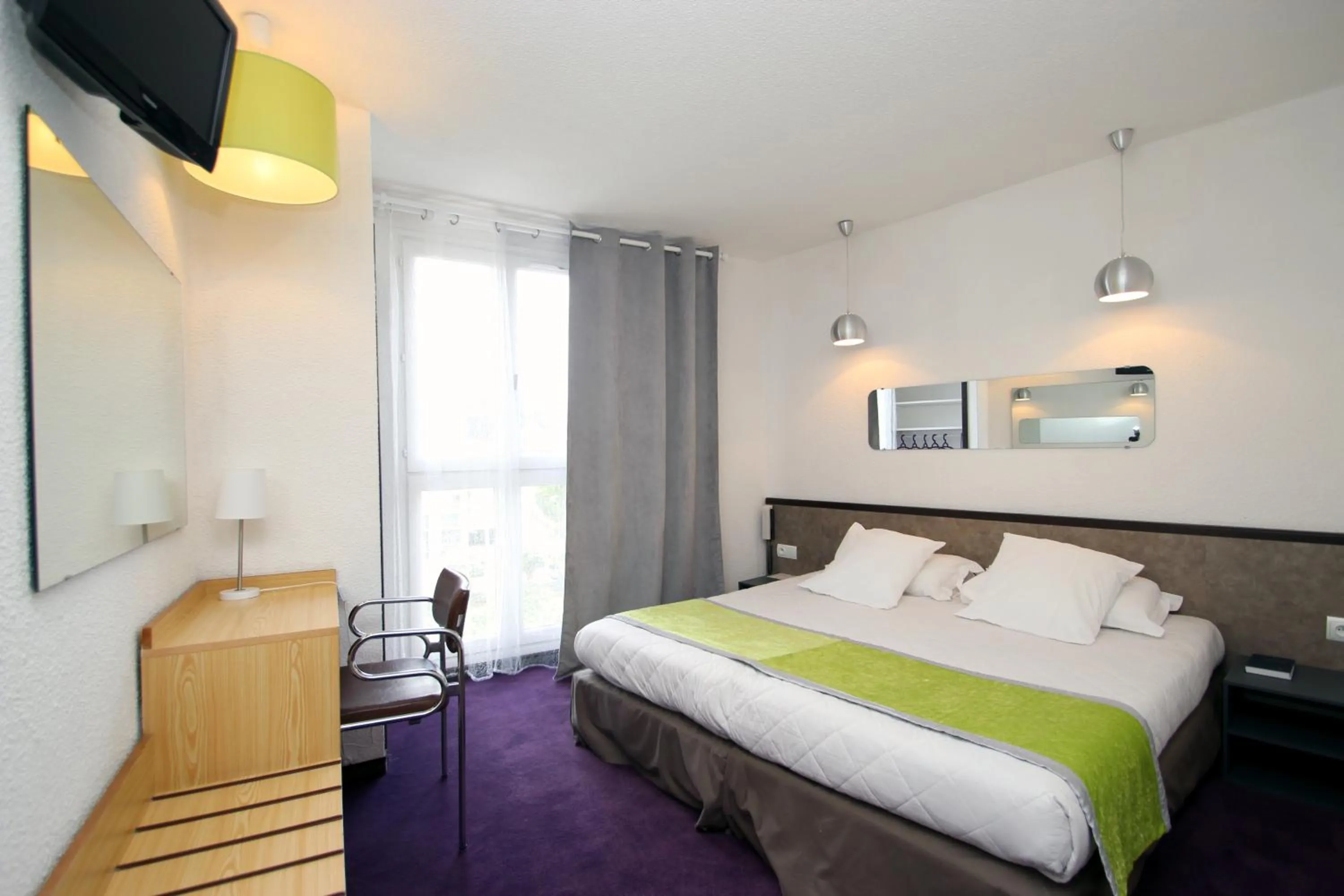 Photo of the whole room, Bed in Hôtel Peyramale