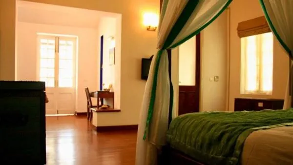 Bed in Old Lighthouse Bristow Hotel , Fort Kochi