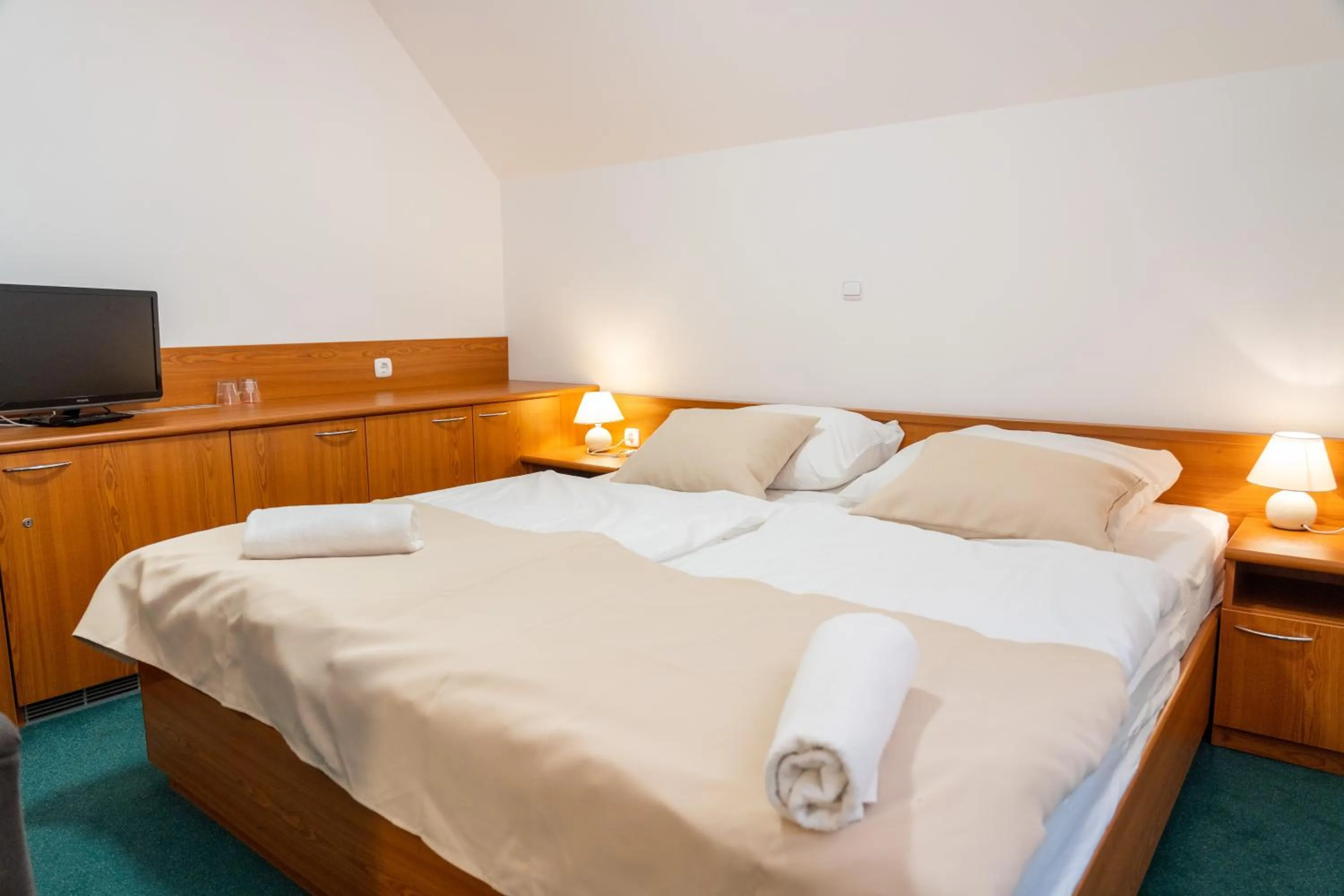 Communal lounge/ TV room, Bed in Hotel Tisa Pohorje