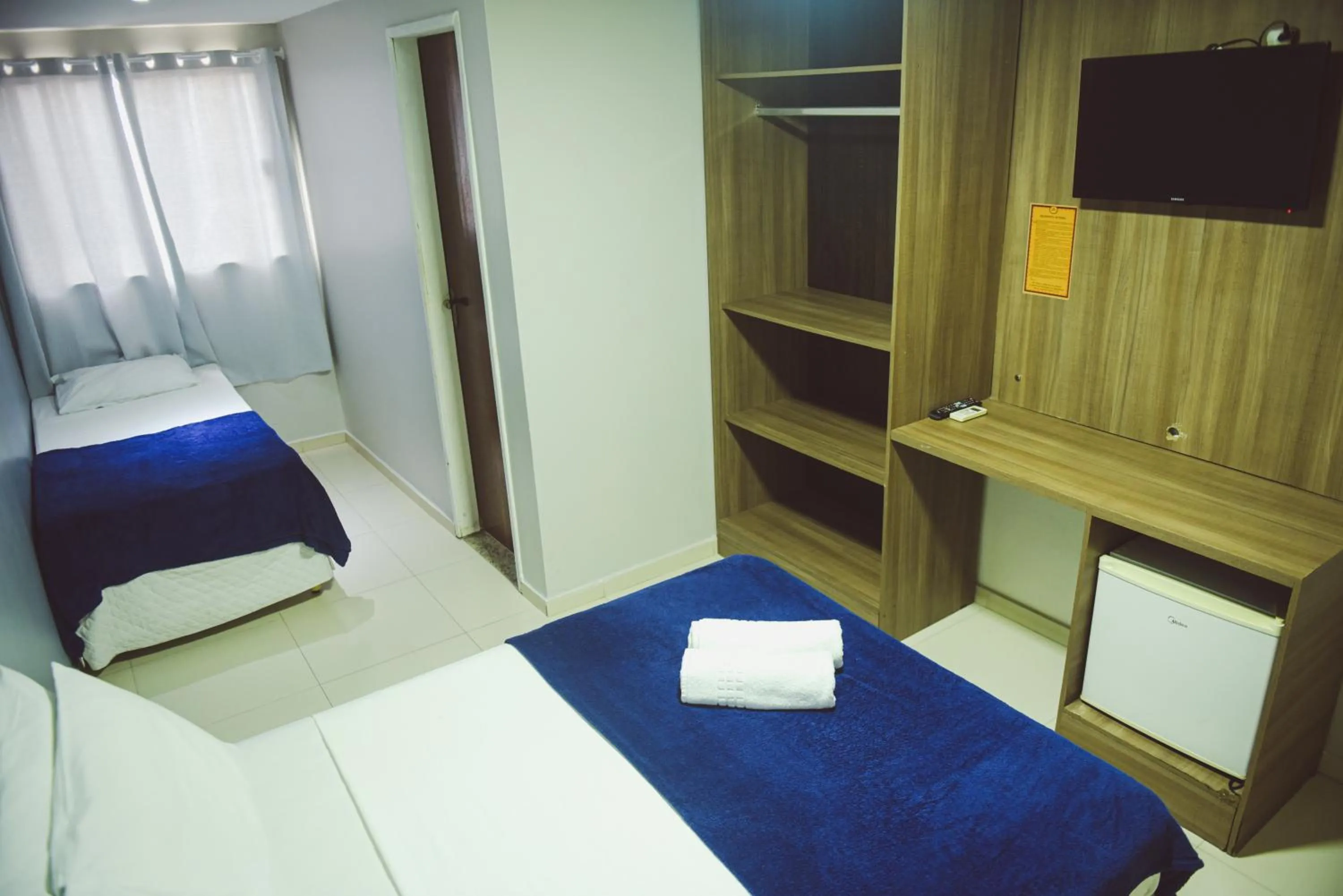 Bed in Pousada Xerxes