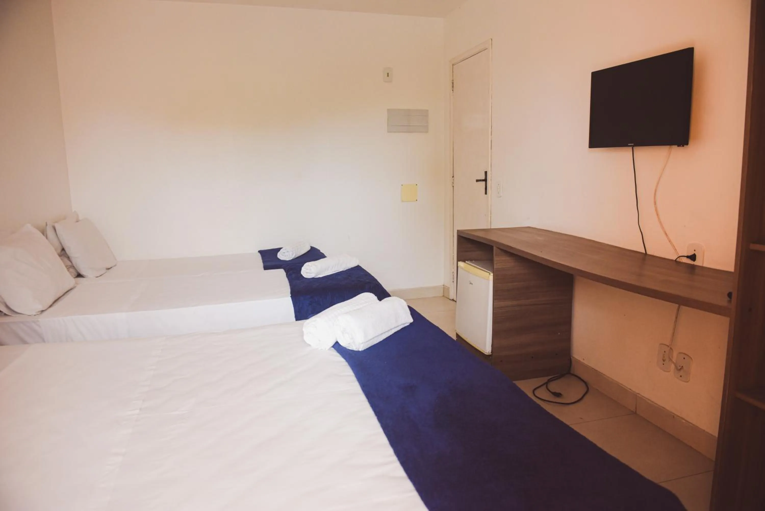 Bed in Pousada Xerxes