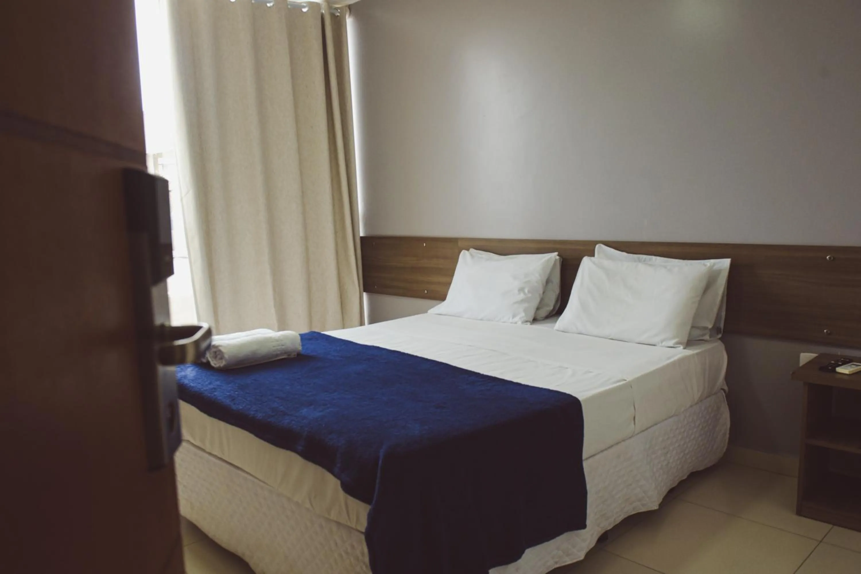 Bed in Pousada Xerxes