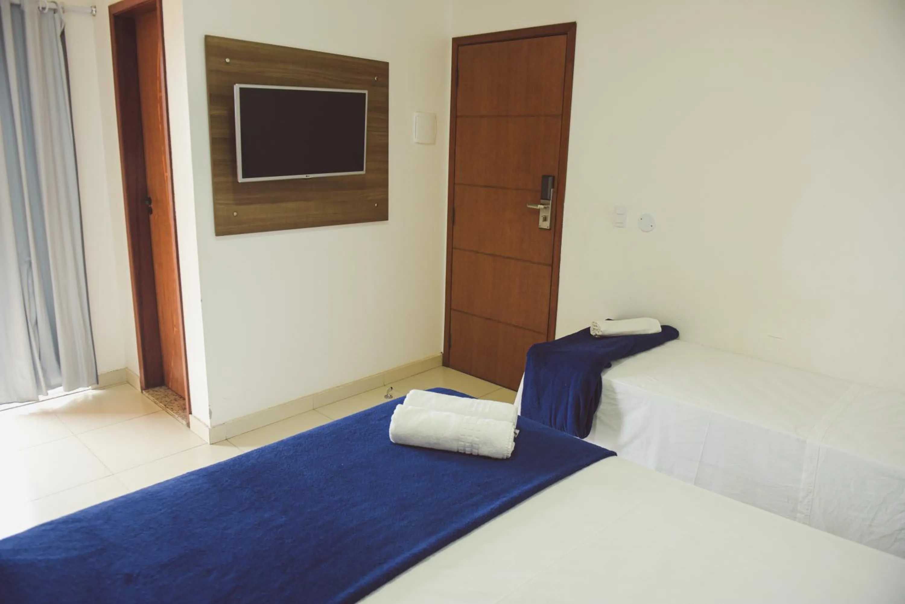 Bed in Pousada Xerxes