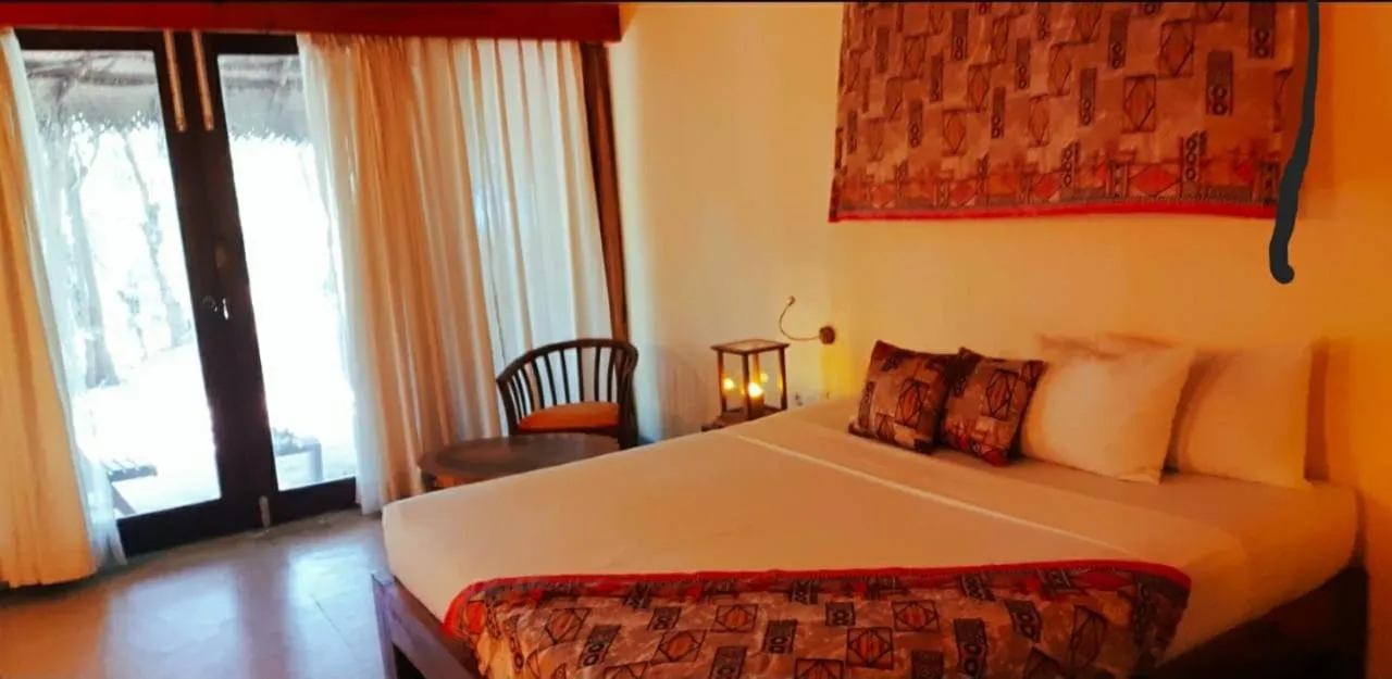 Seating area, Bed in Giman Free Beach Resort Pasikuda