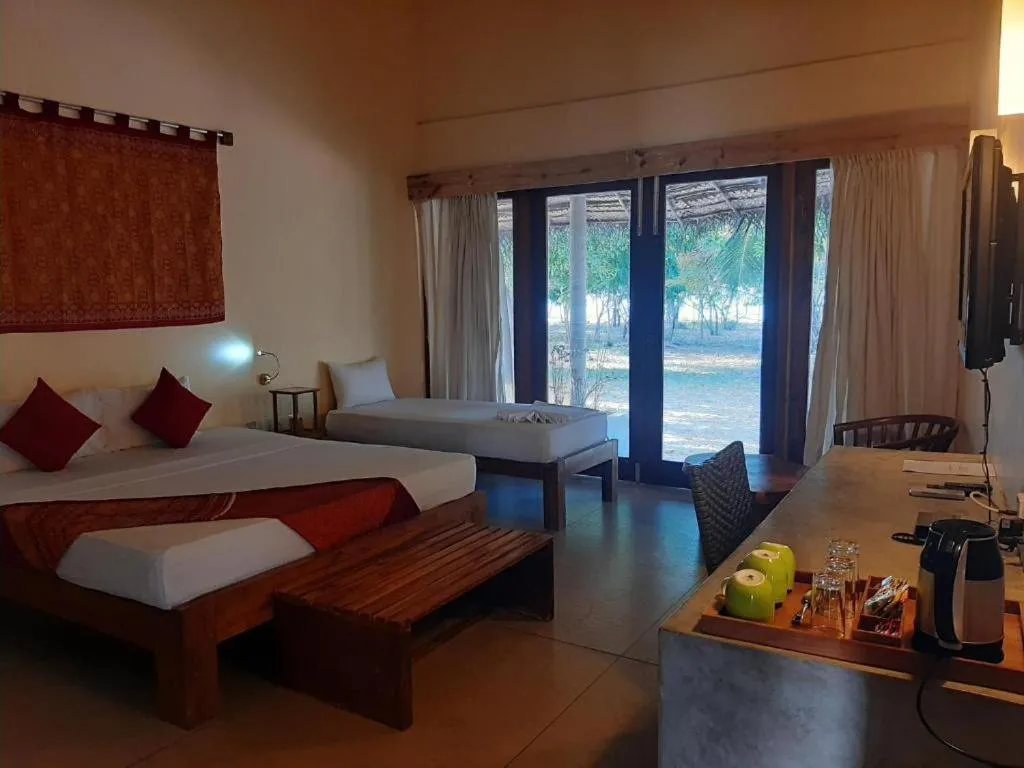 View (from property/room), Bed in Giman Free Beach Resort Pasikuda