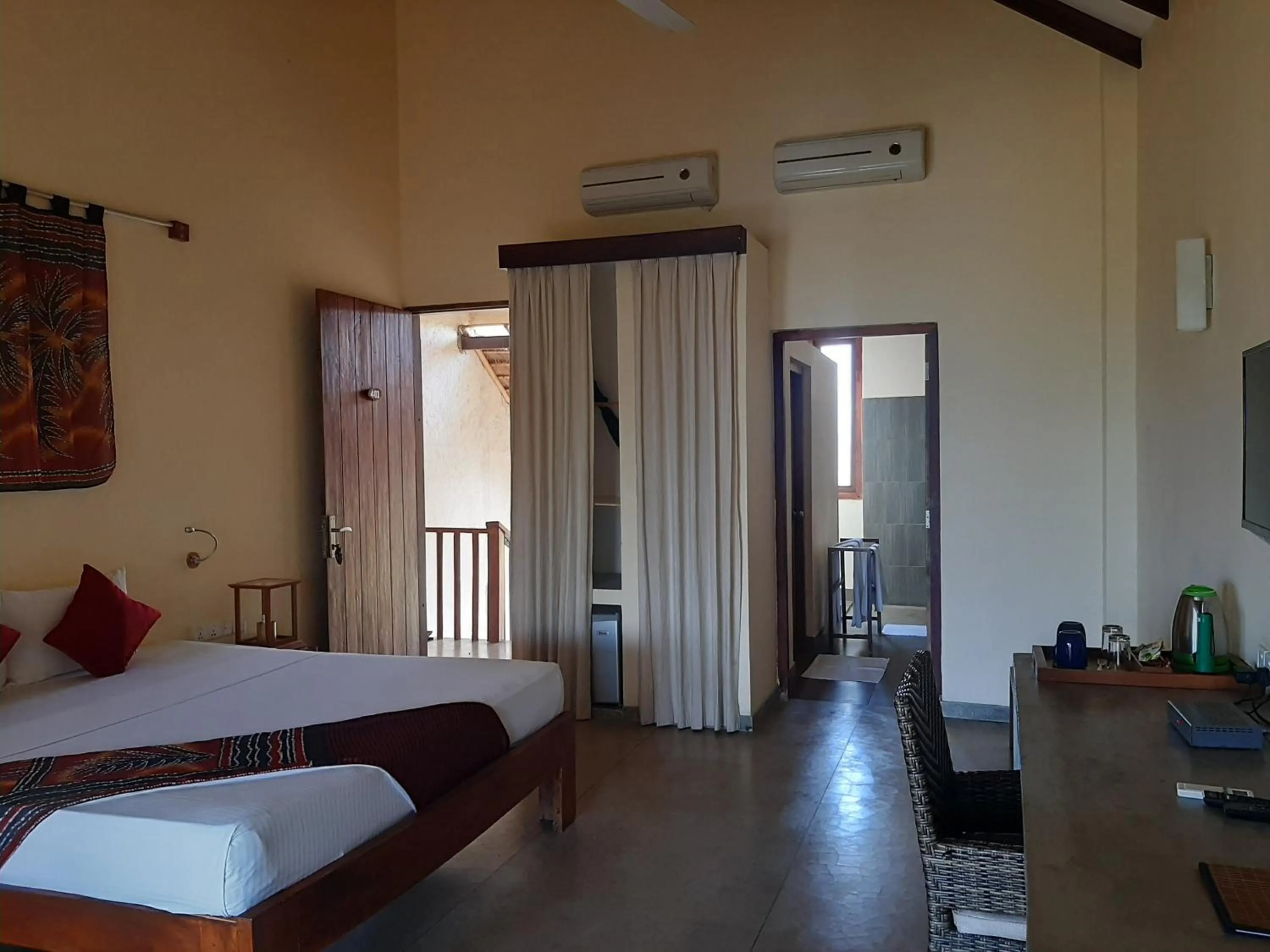 Bed in Giman Free Beach Resort Pasikuda