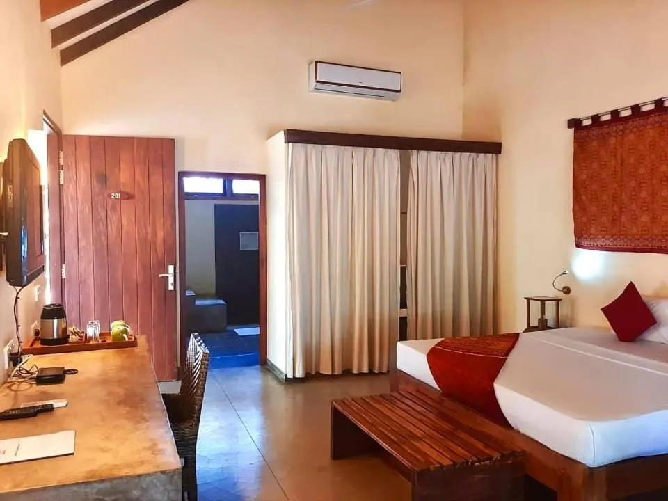 Bed in Giman Free Beach Resort Pasikuda