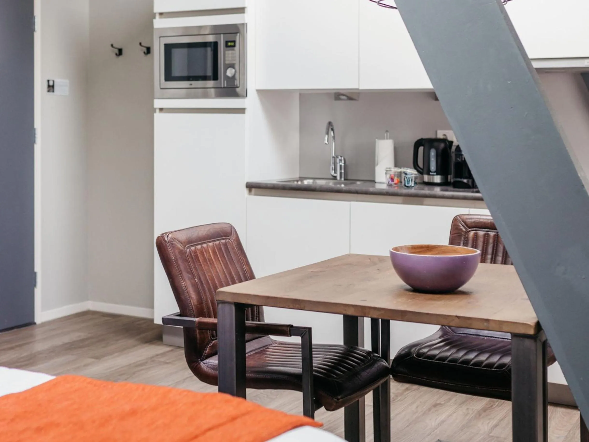 Dining area in YAYS Amsterdam Maritime by Numa