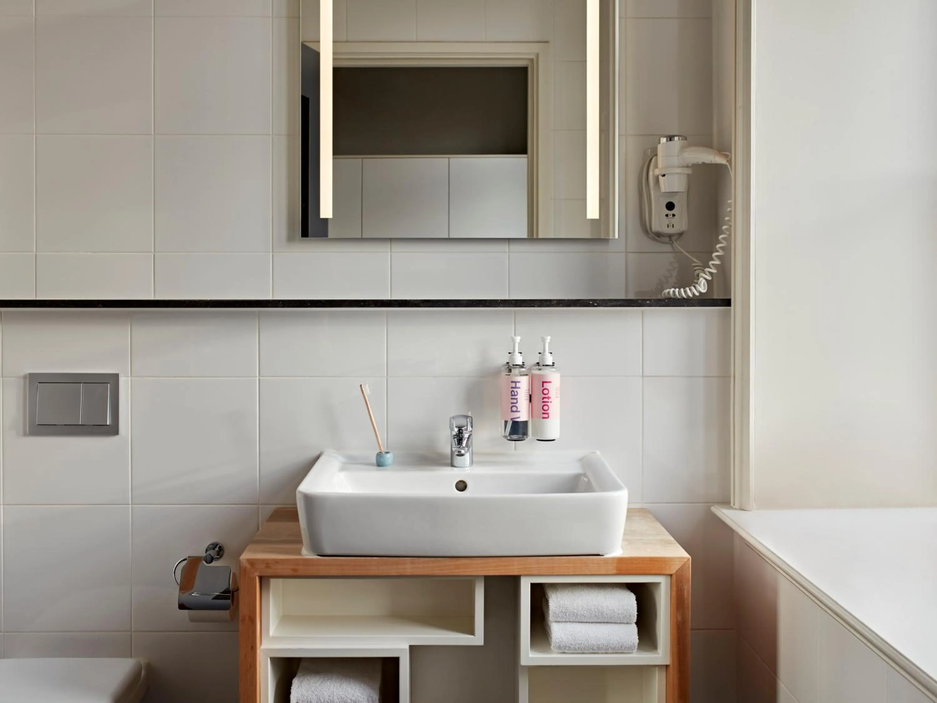 Bathroom in YAYS Amsterdam Maritime by Numa
