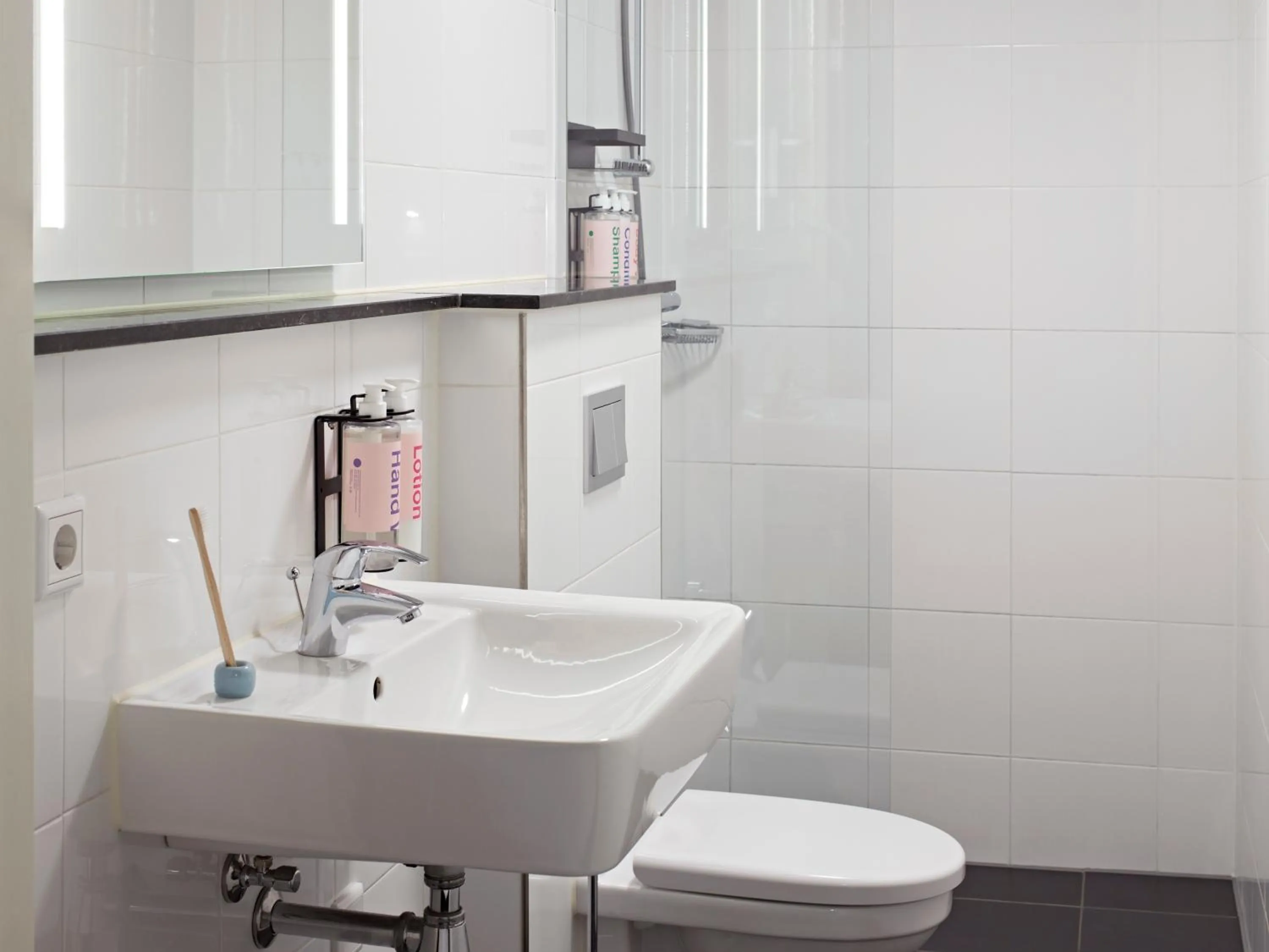 Toilet in YAYS Amsterdam Maritime by Numa