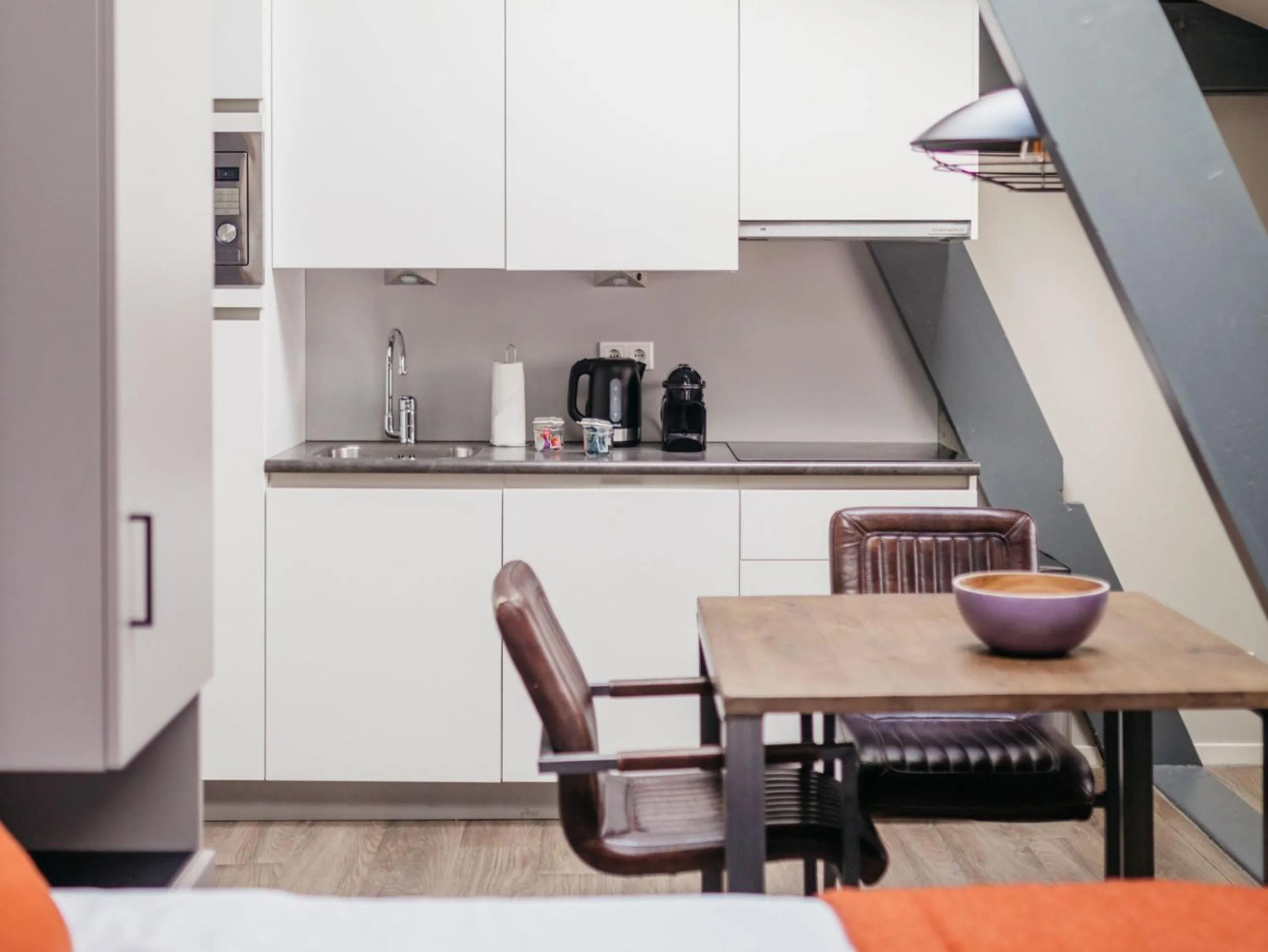 Dining area in YAYS Amsterdam Maritime by Numa