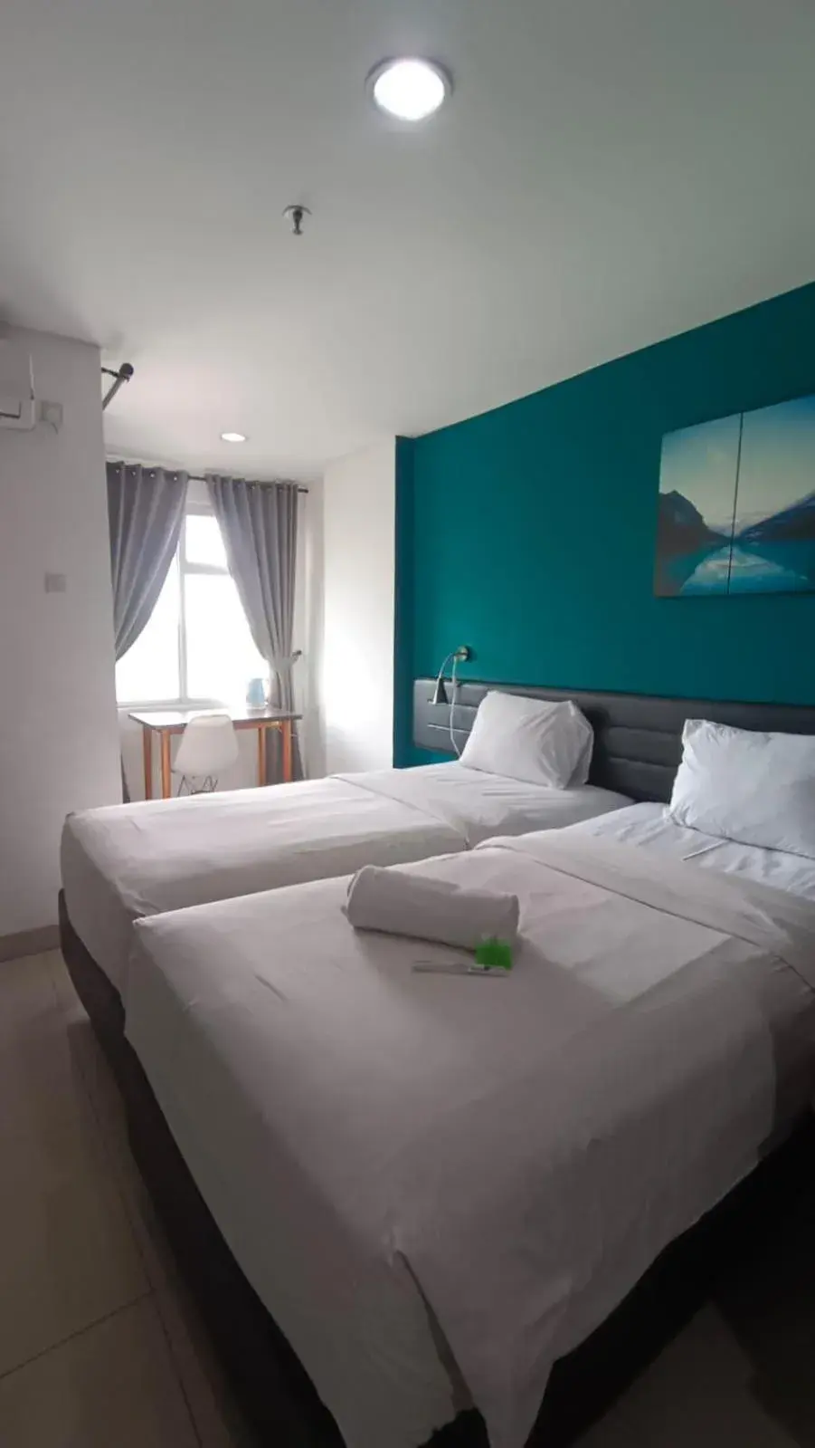 Deluxe Twin Room in Izi Cozi Kemayoran Powered by Archipelago Deluxe Twin Room in Izi Cozi Kemayoran Powered by Archipelago