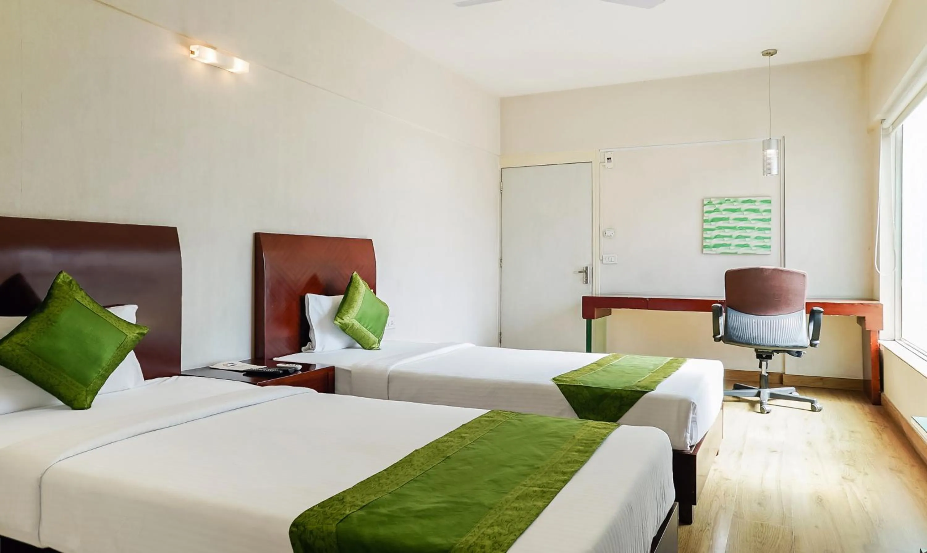 Bedroom, Bed in Treebo Brooks Manor