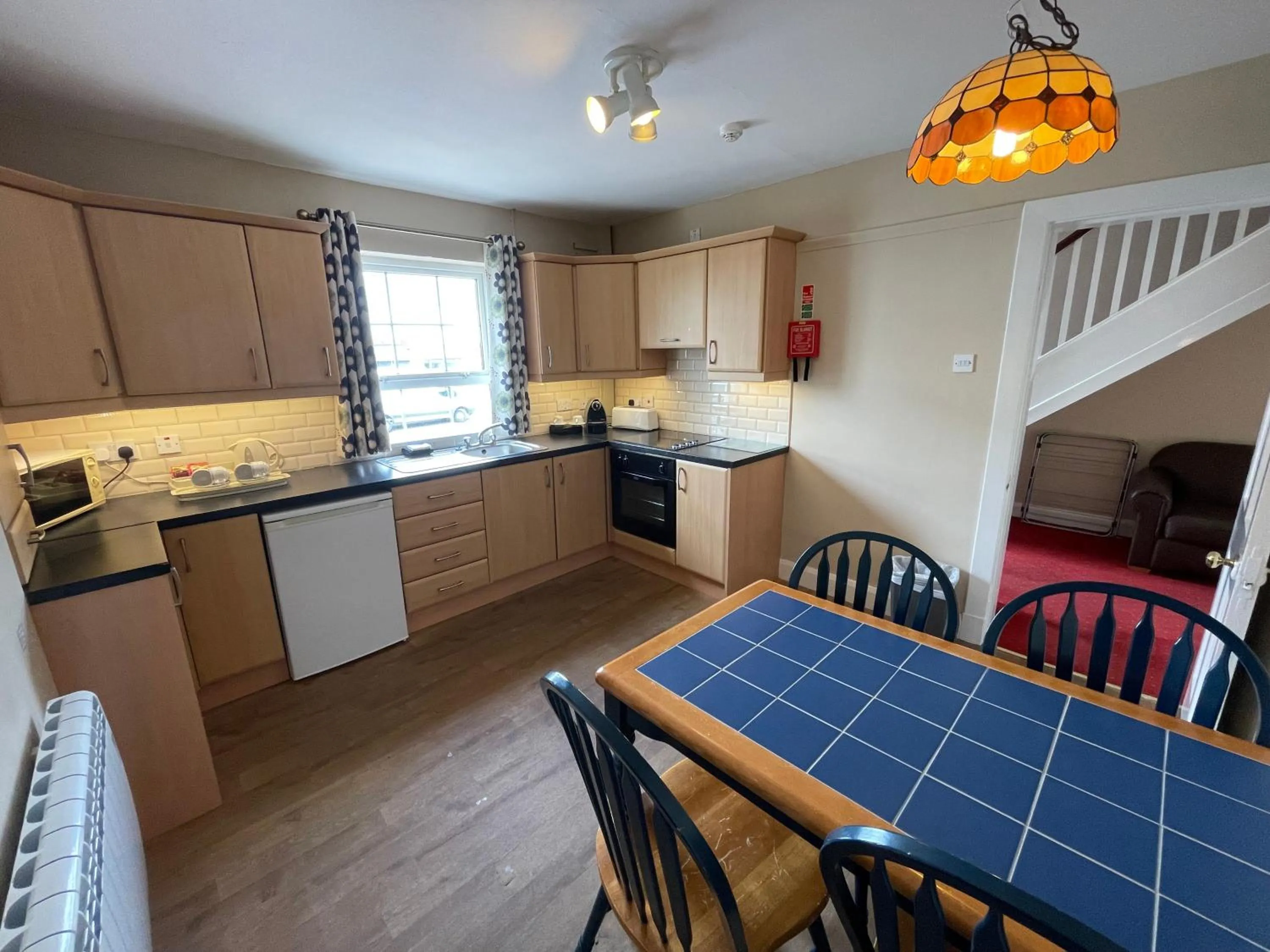 Kitchen or kitchenette in Belmore Court & Motel