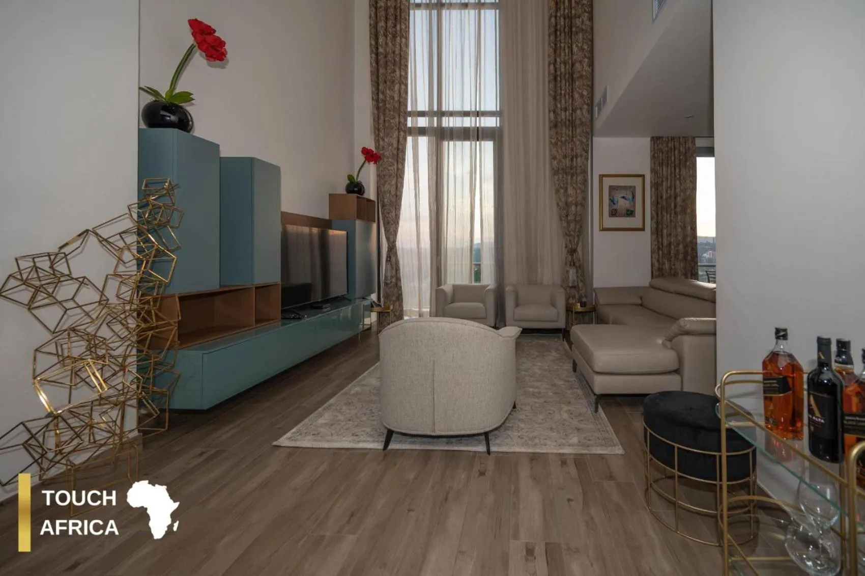 Communal lounge/ TV room in Africa's Touch & Leisure