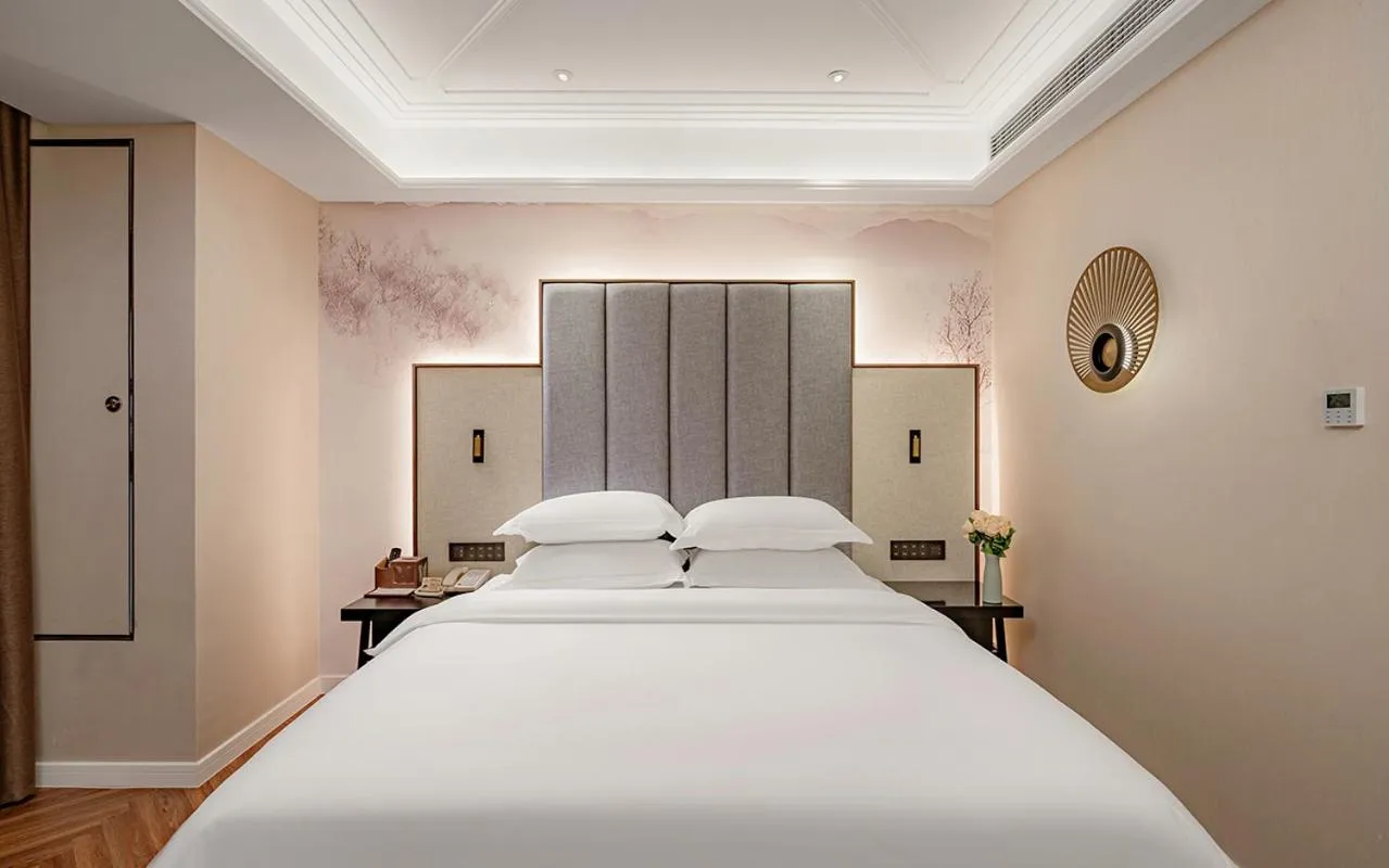 Bed in Metropolo Hotel Xuzhou High-speed Railway Station Jinlonghu