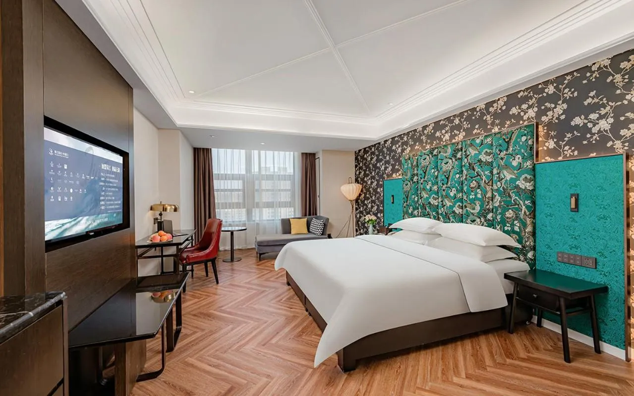 Bed in Metropolo Hotel Xuzhou High-speed Railway Station Jinlonghu