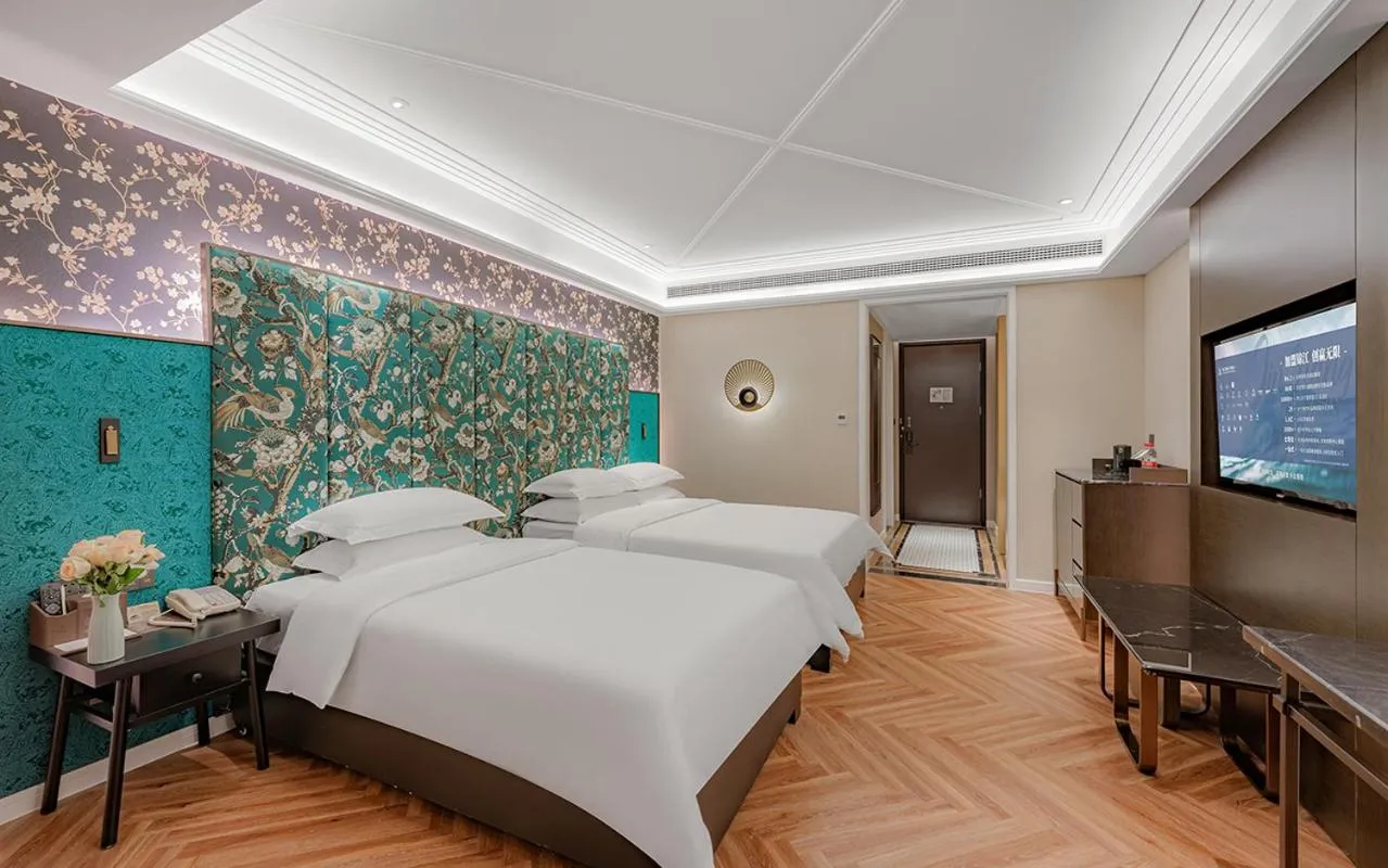 Bed in Metropolo Hotel Xuzhou High-speed Railway Station Jinlonghu