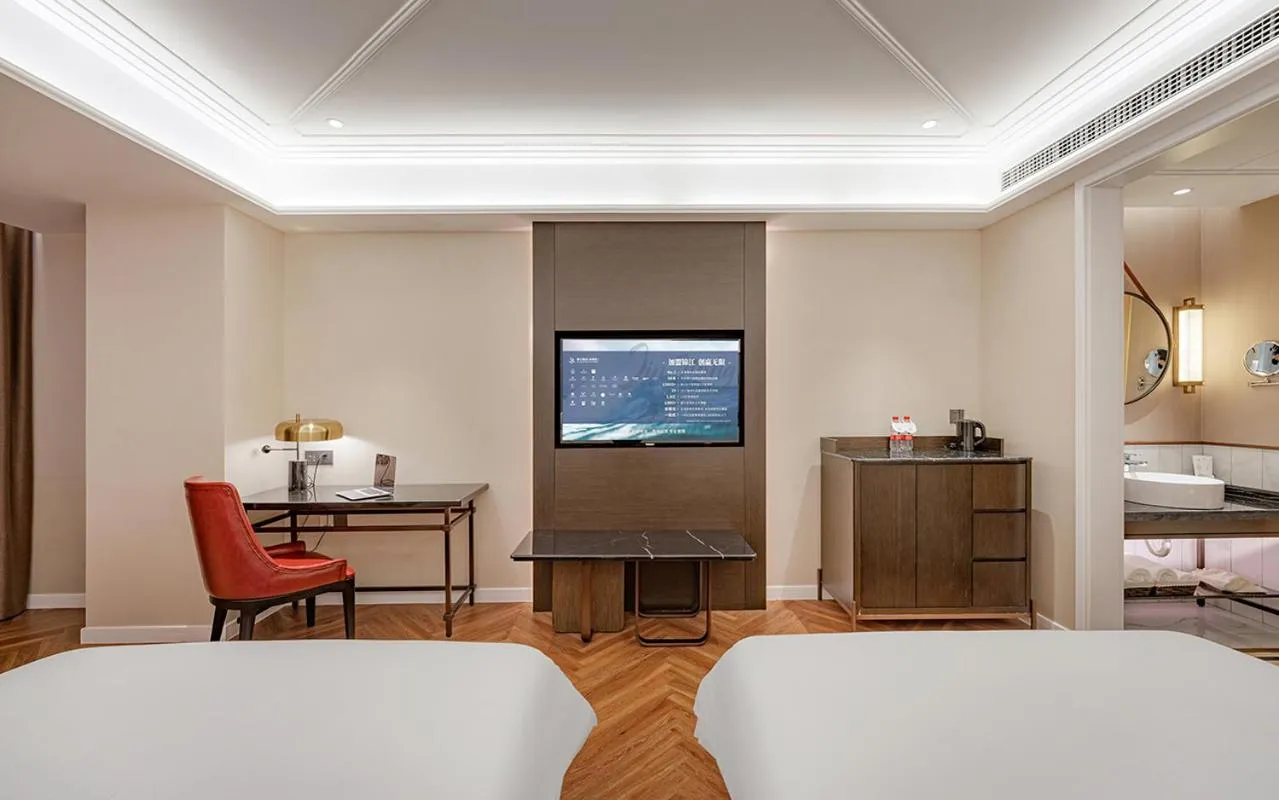 Bed in Metropolo Hotel Xuzhou High-speed Railway Station Jinlonghu