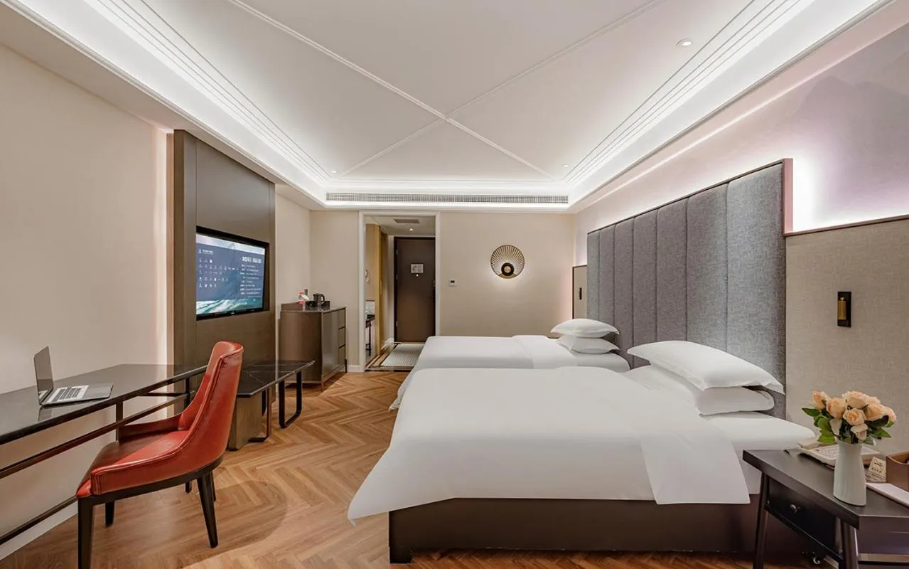 Bed in Metropolo Hotel Xuzhou High-speed Railway Station Jinlonghu