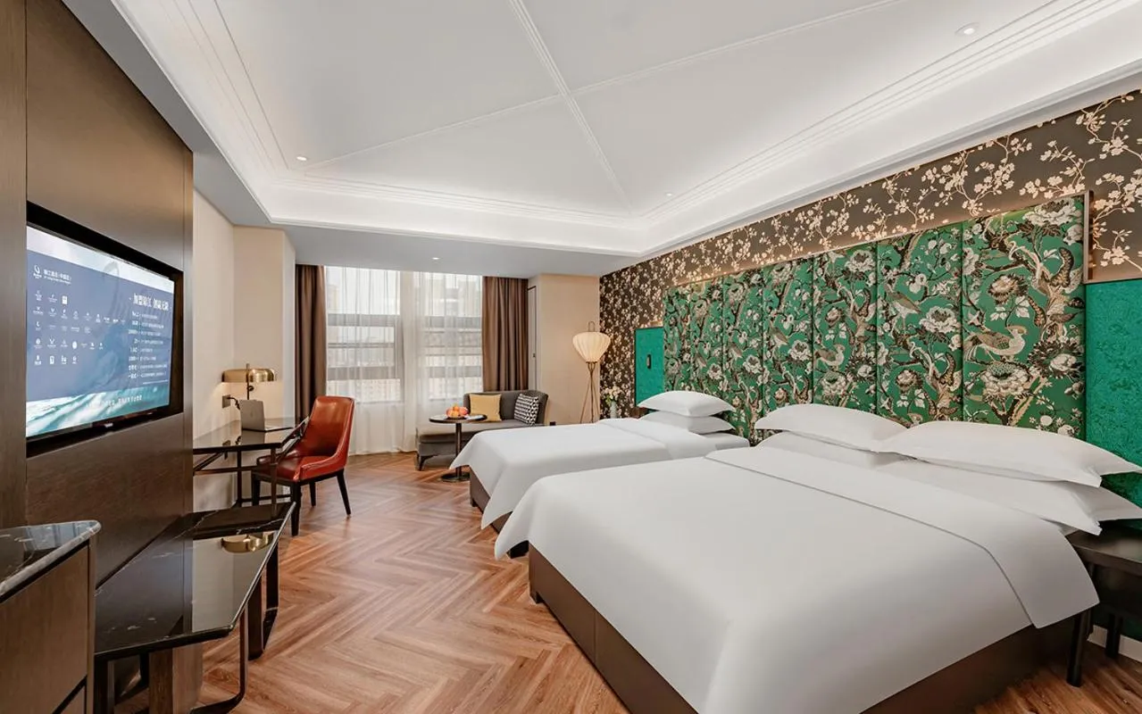 Bed in Metropolo Hotel Xuzhou High-speed Railway Station Jinlonghu