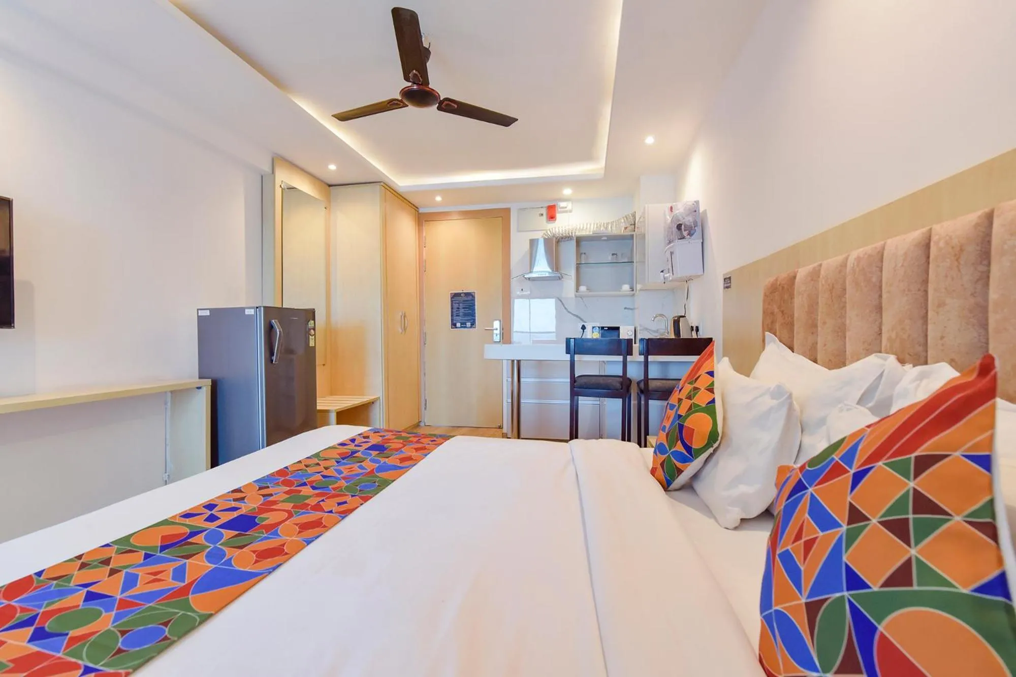 Bed in FabHotel Anukampa With Swimming Pool