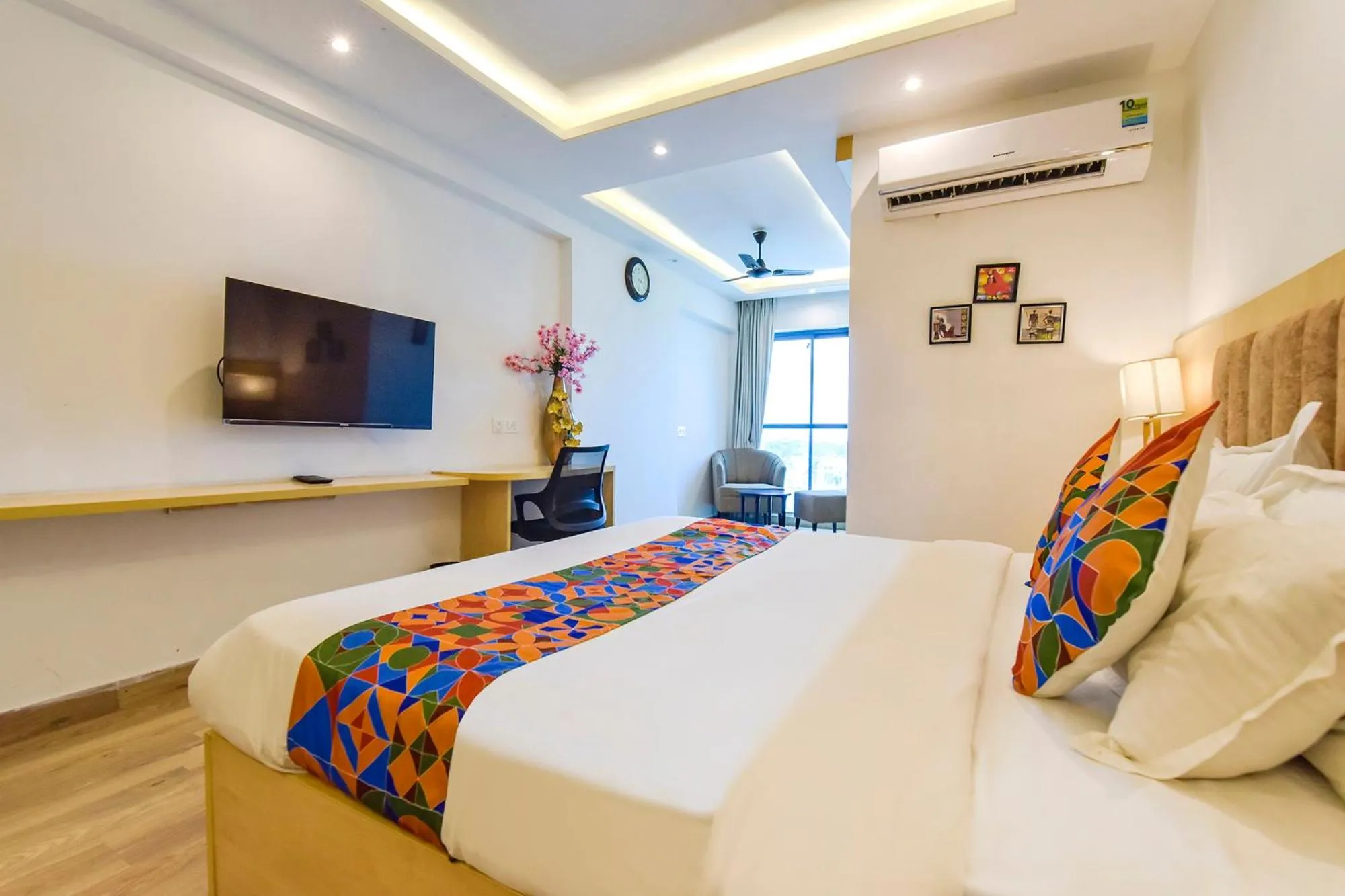 Bed in FabHotel Anukampa With Swimming Pool