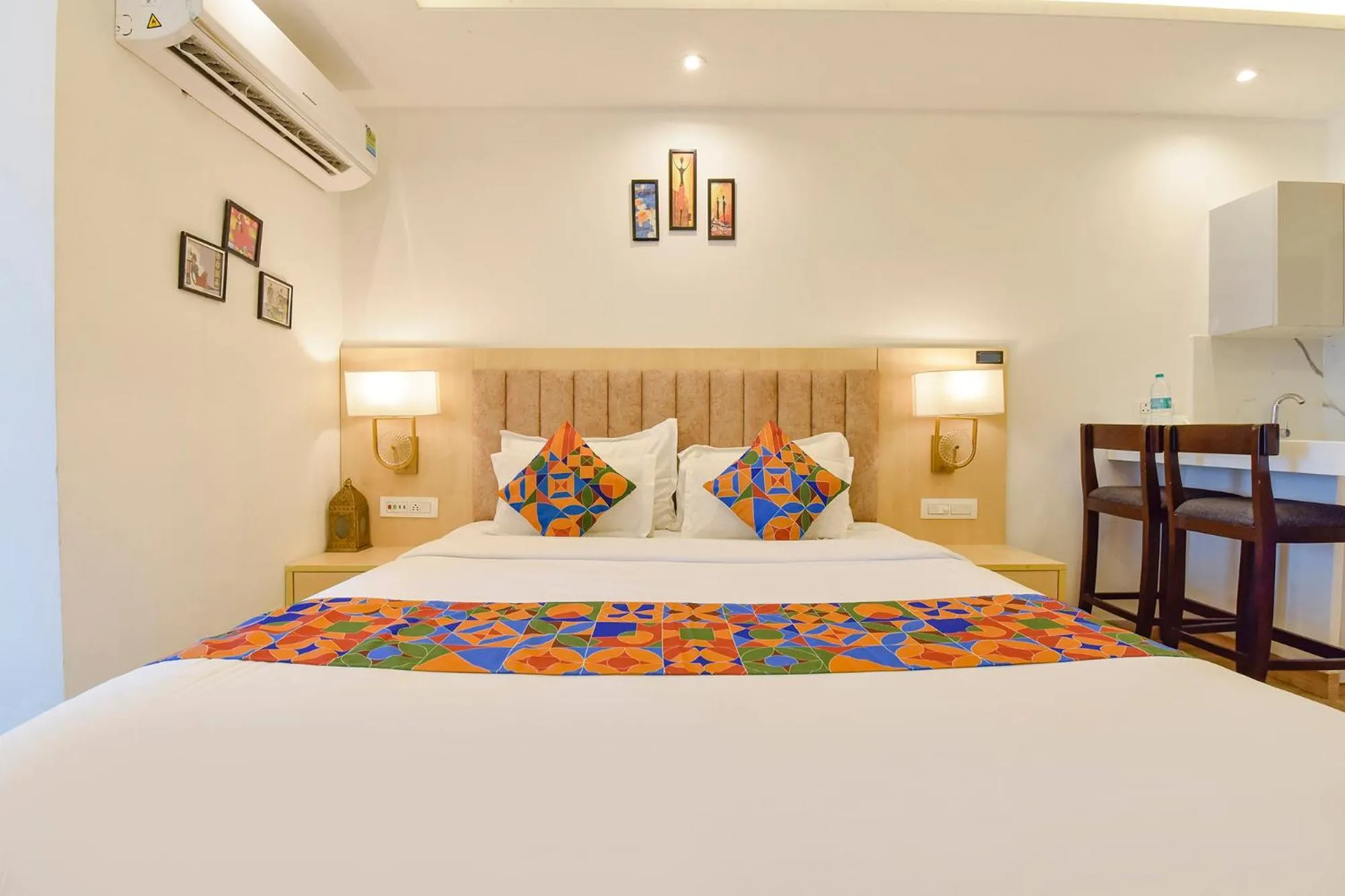 Bed in FabHotel Anukampa With Swimming Pool