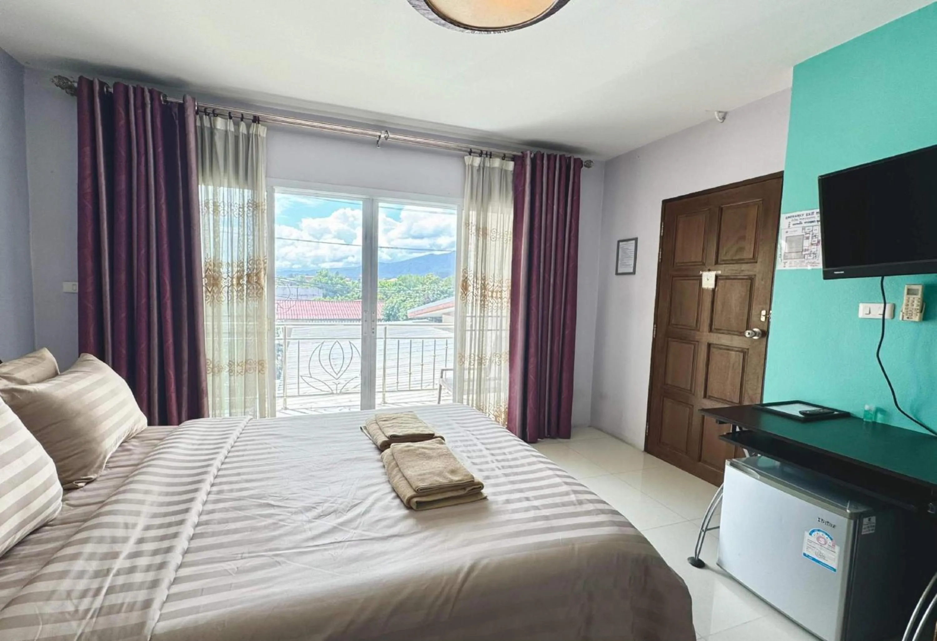 Photo of the whole room, Bed in Collection O Bupamontra Chiangmai