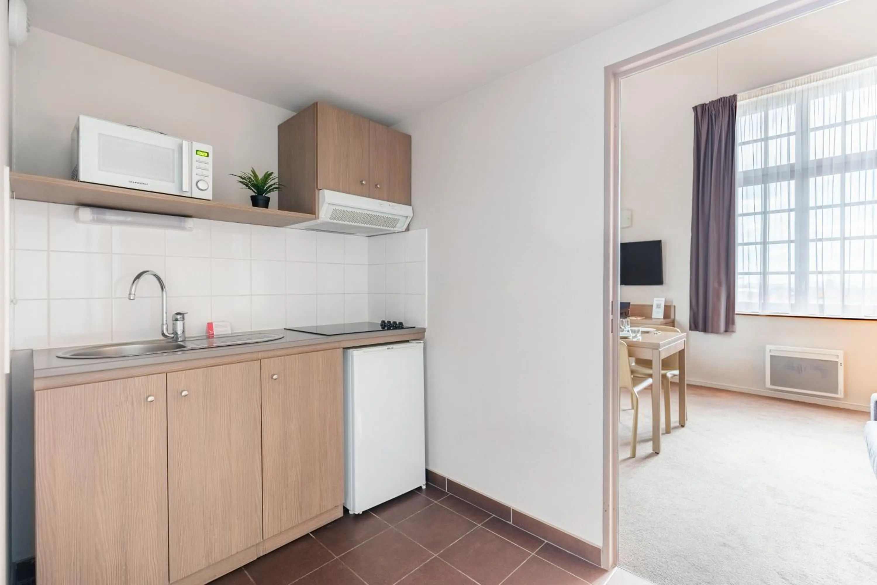 Kitchen or kitchenette in Appart’City Confort Reims Centre