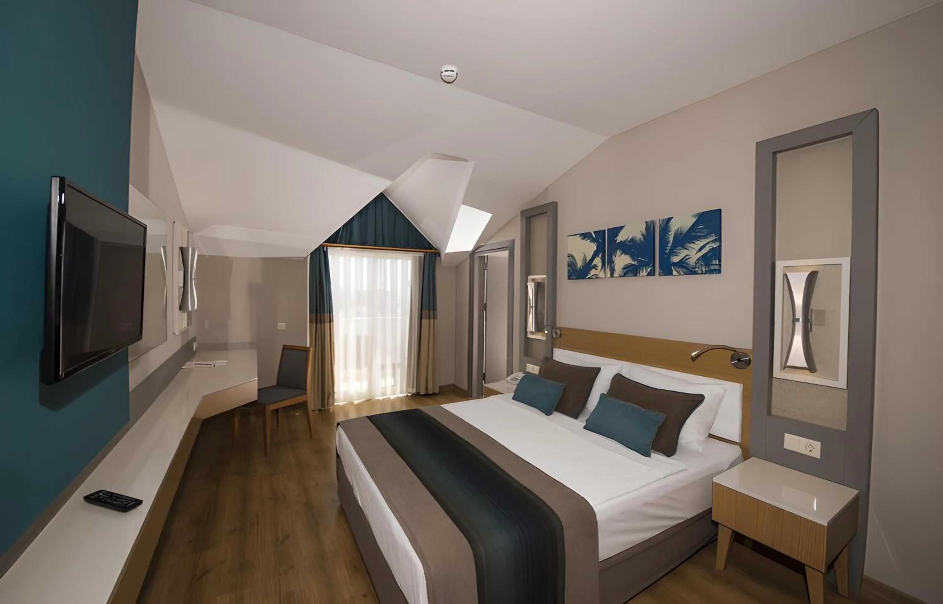 Bed in Palm World Side Resort & Spa