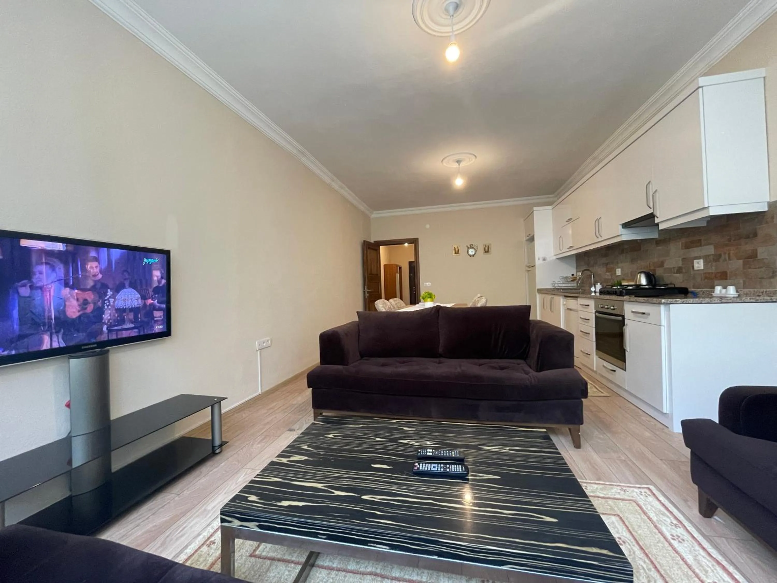 Communal lounge/ TV room in Select Suite & Apart Hotel