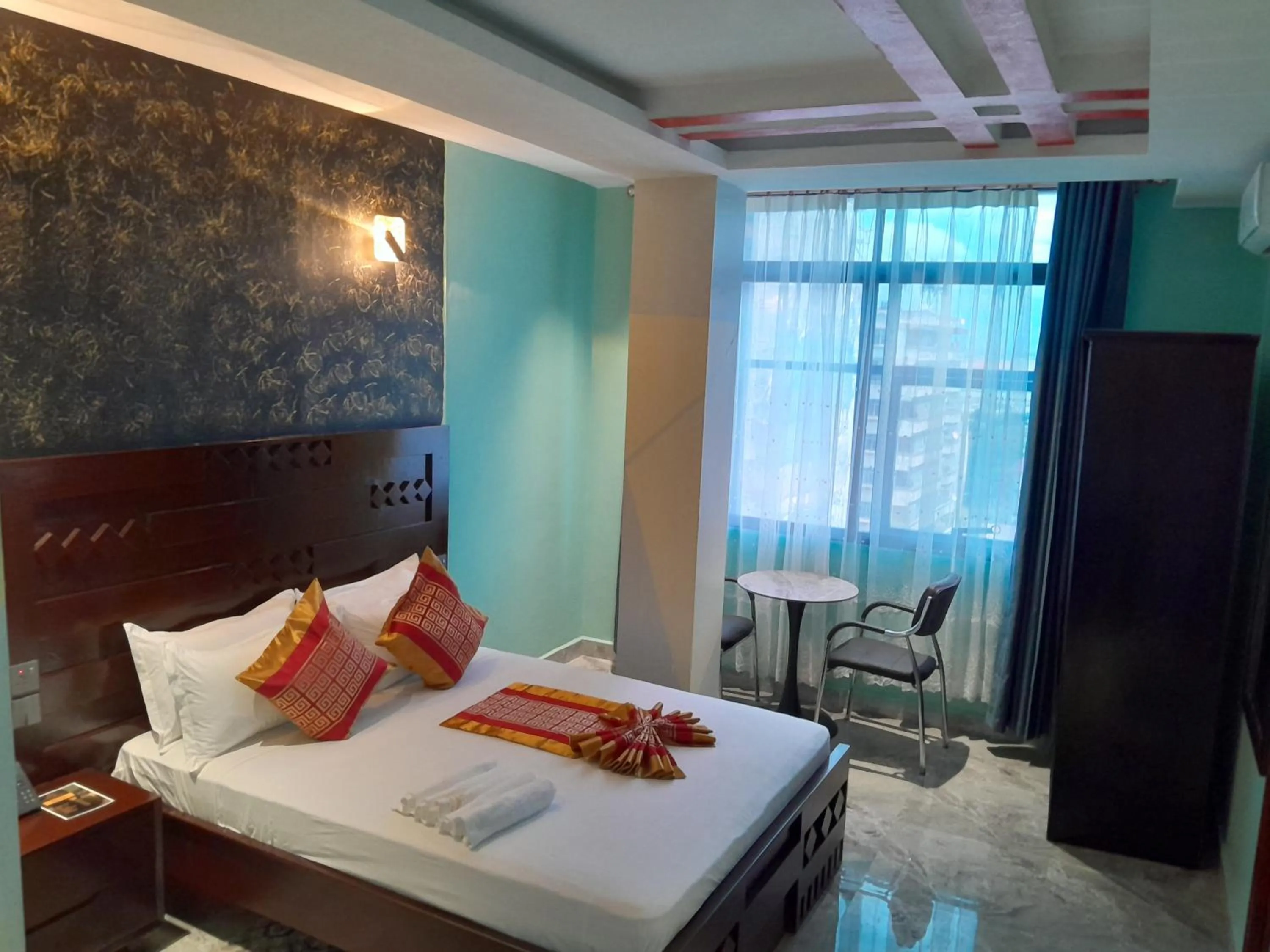 Bed in Mazola Diamond Hotel