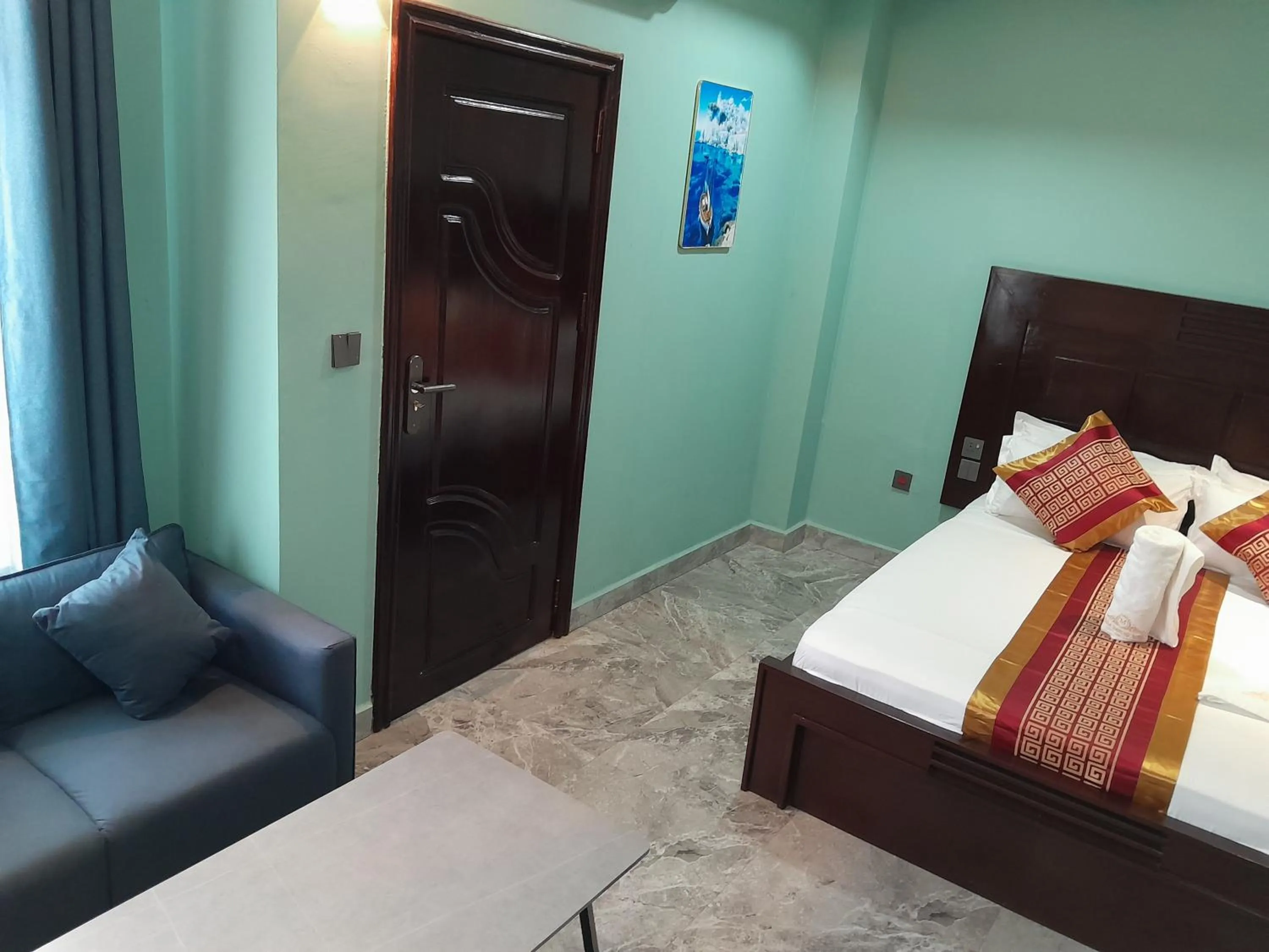 Seating area, Bed in Mazola Diamond Hotel