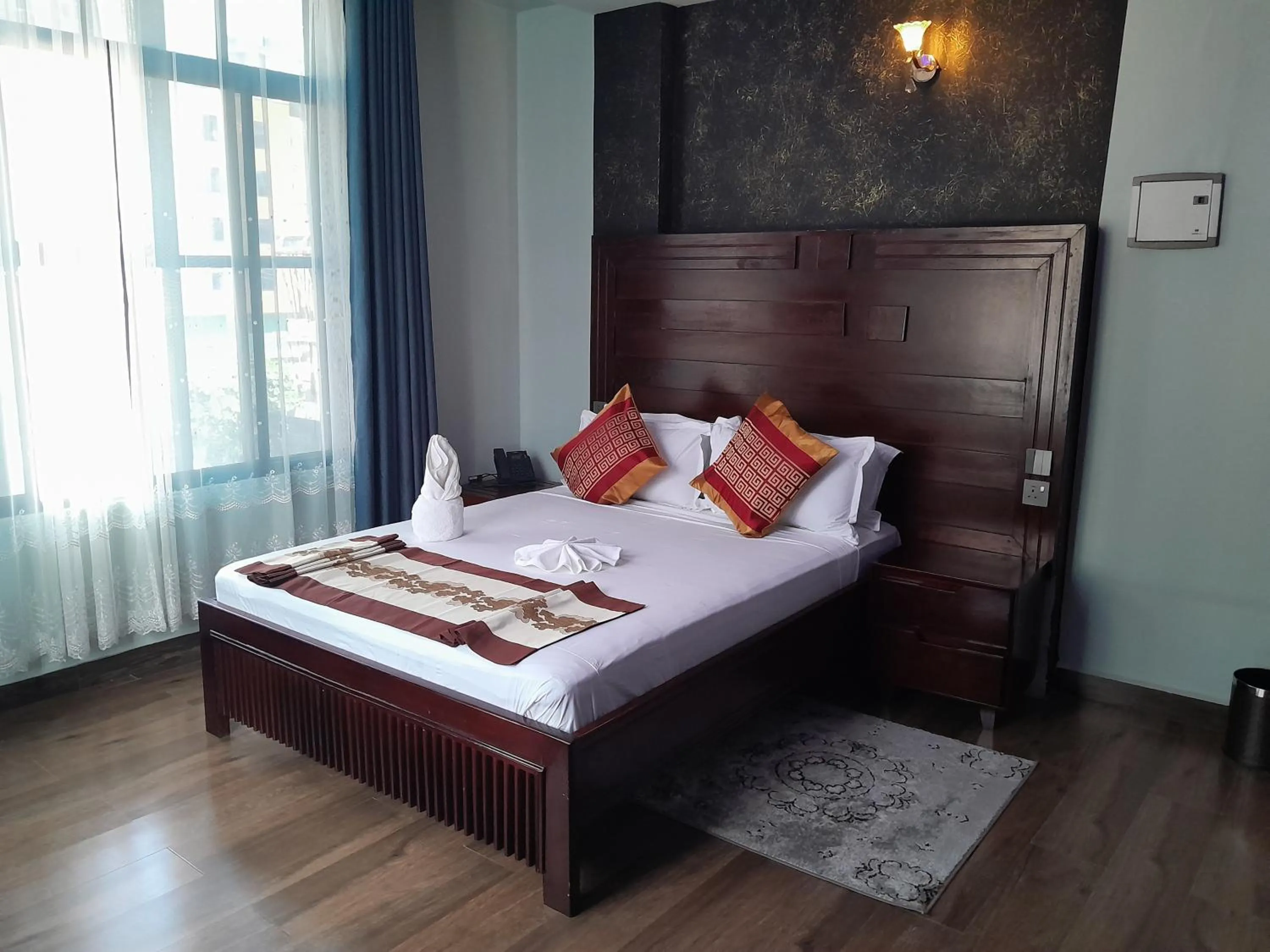 Bed in Mazola Diamond Hotel