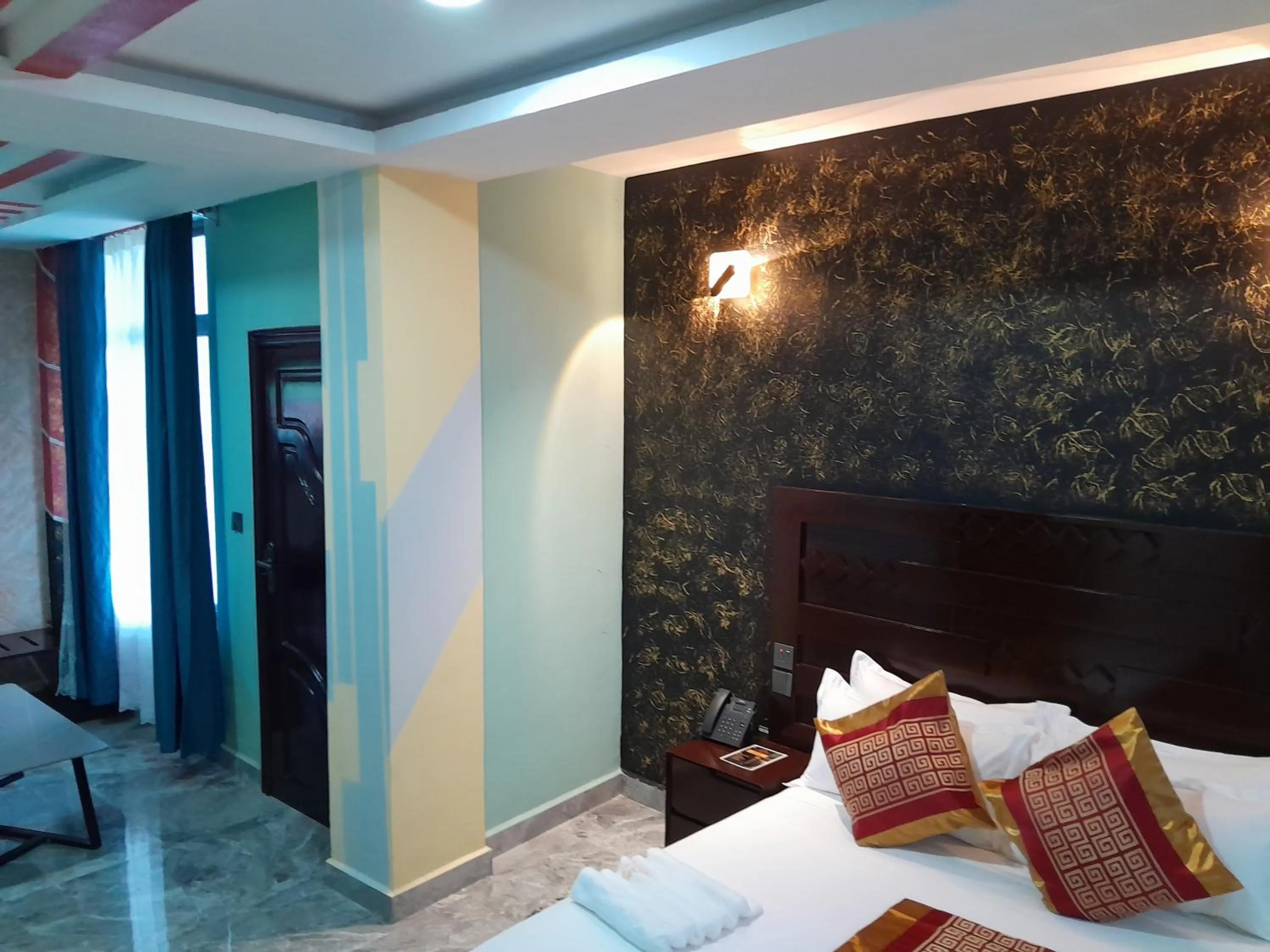 Bed in Mazola Diamond Hotel