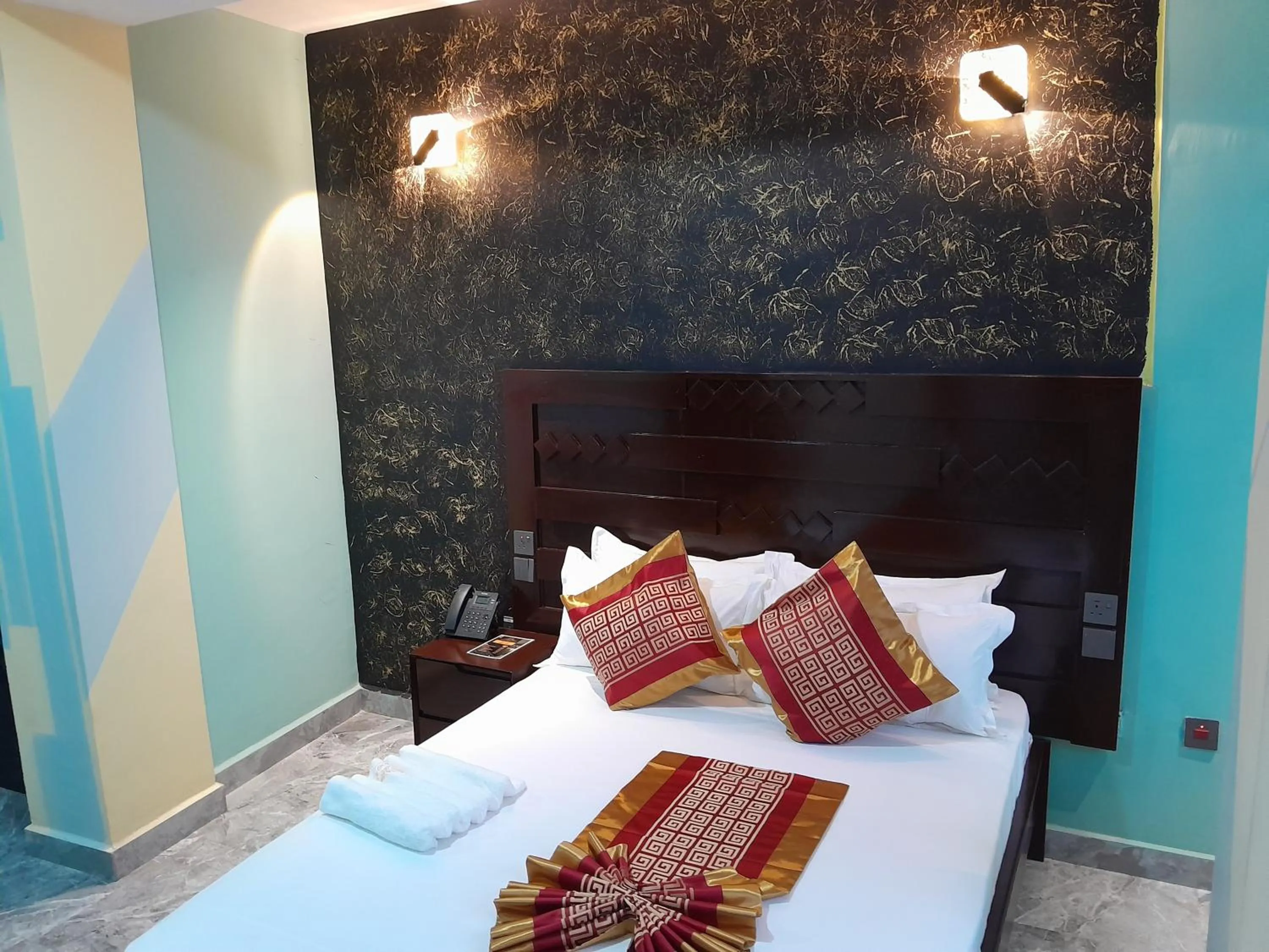 Bed in Mazola Diamond Hotel