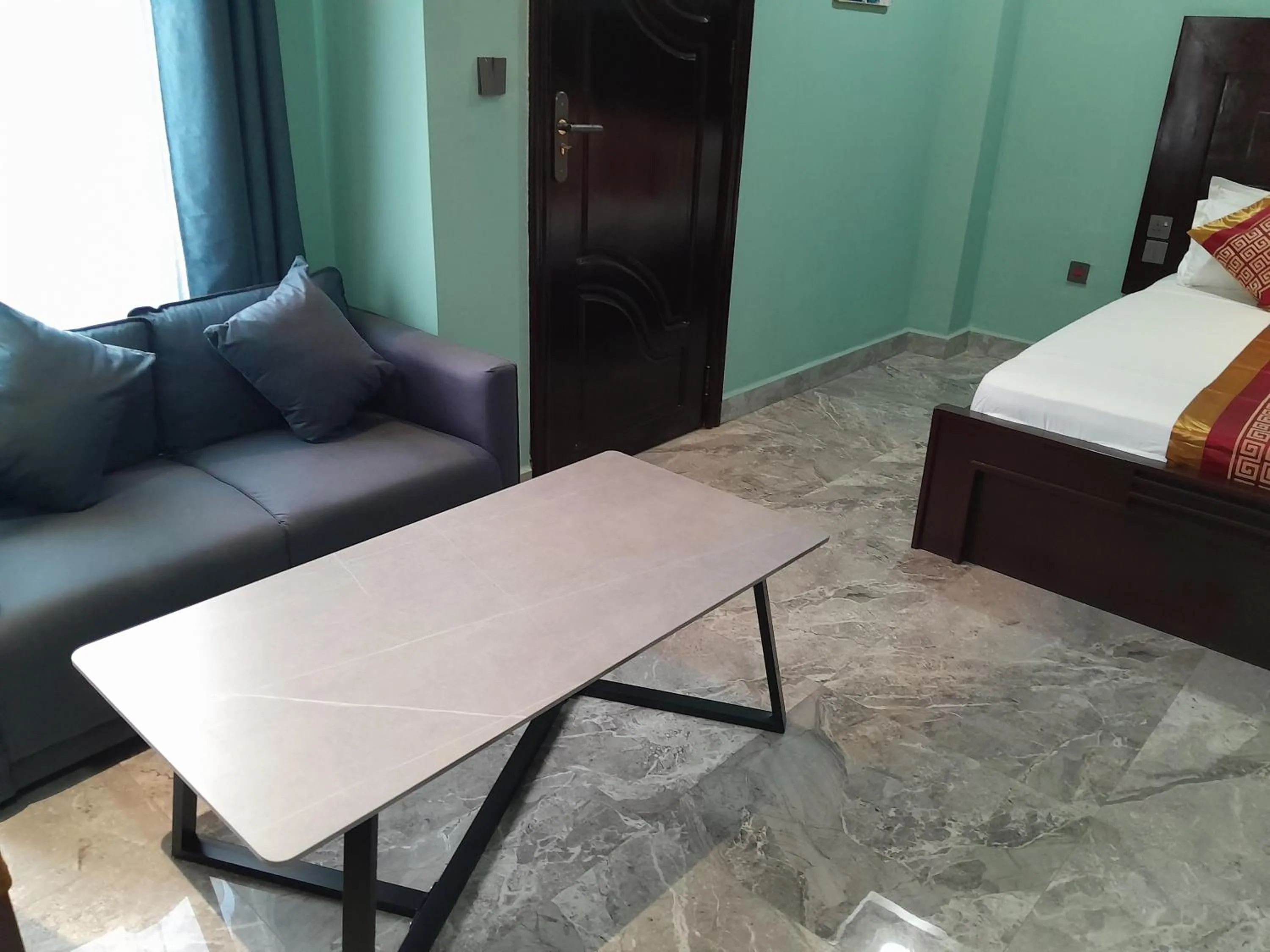 Seating area, Bed in Mazola Diamond Hotel