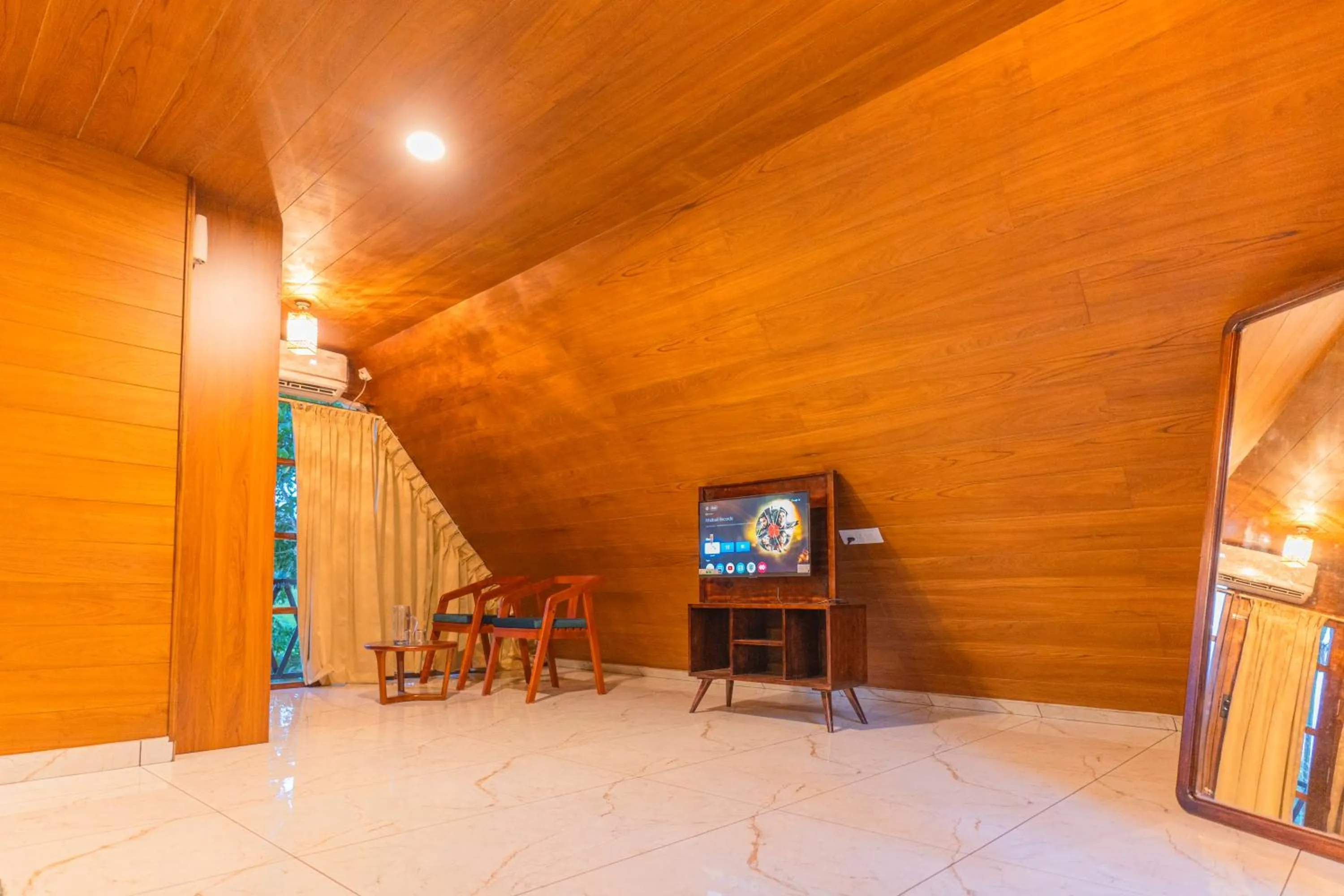 Communal lounge/ TV room in Ethnic Villa Wayanad