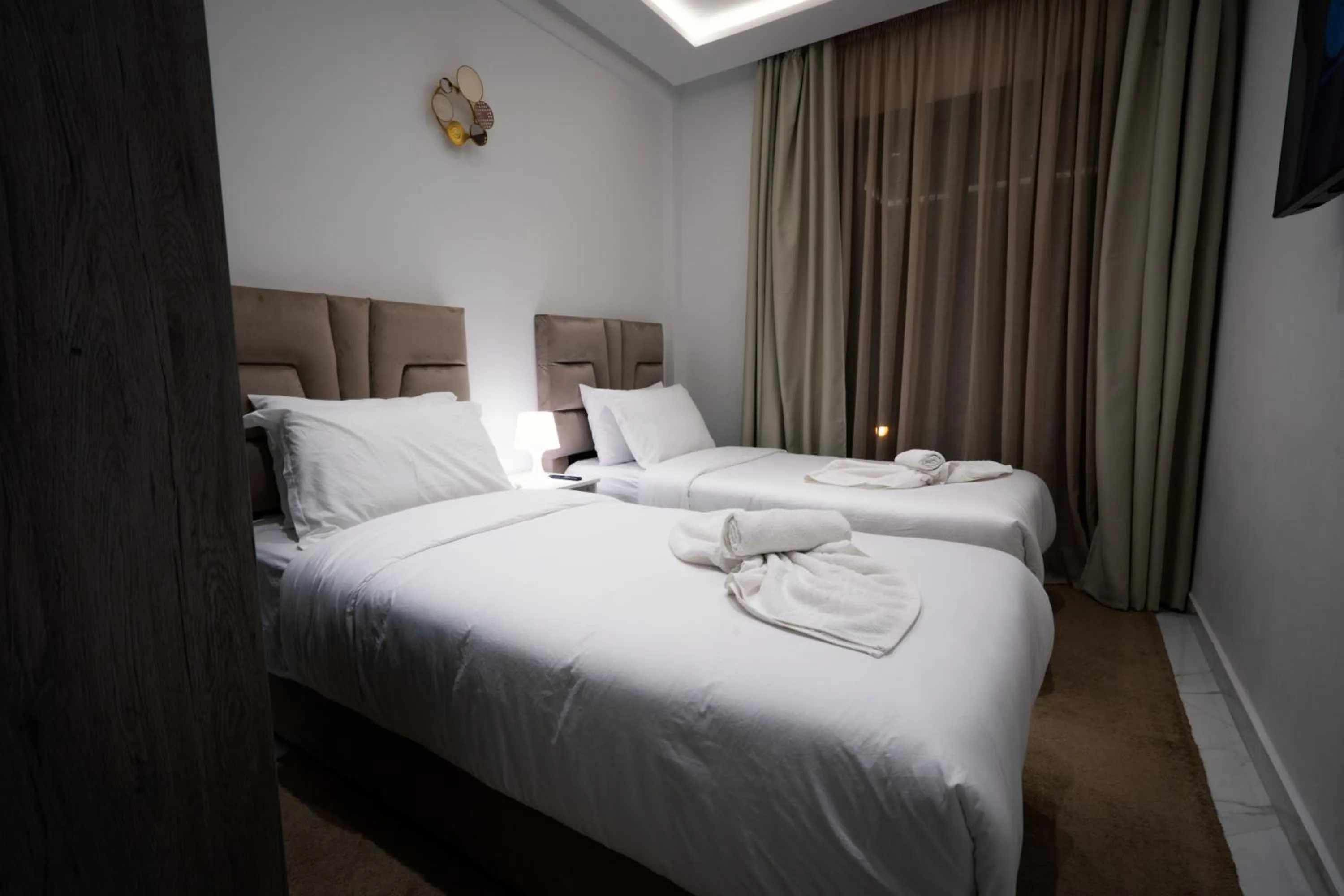 Bed in Amelia Appart-Hotel