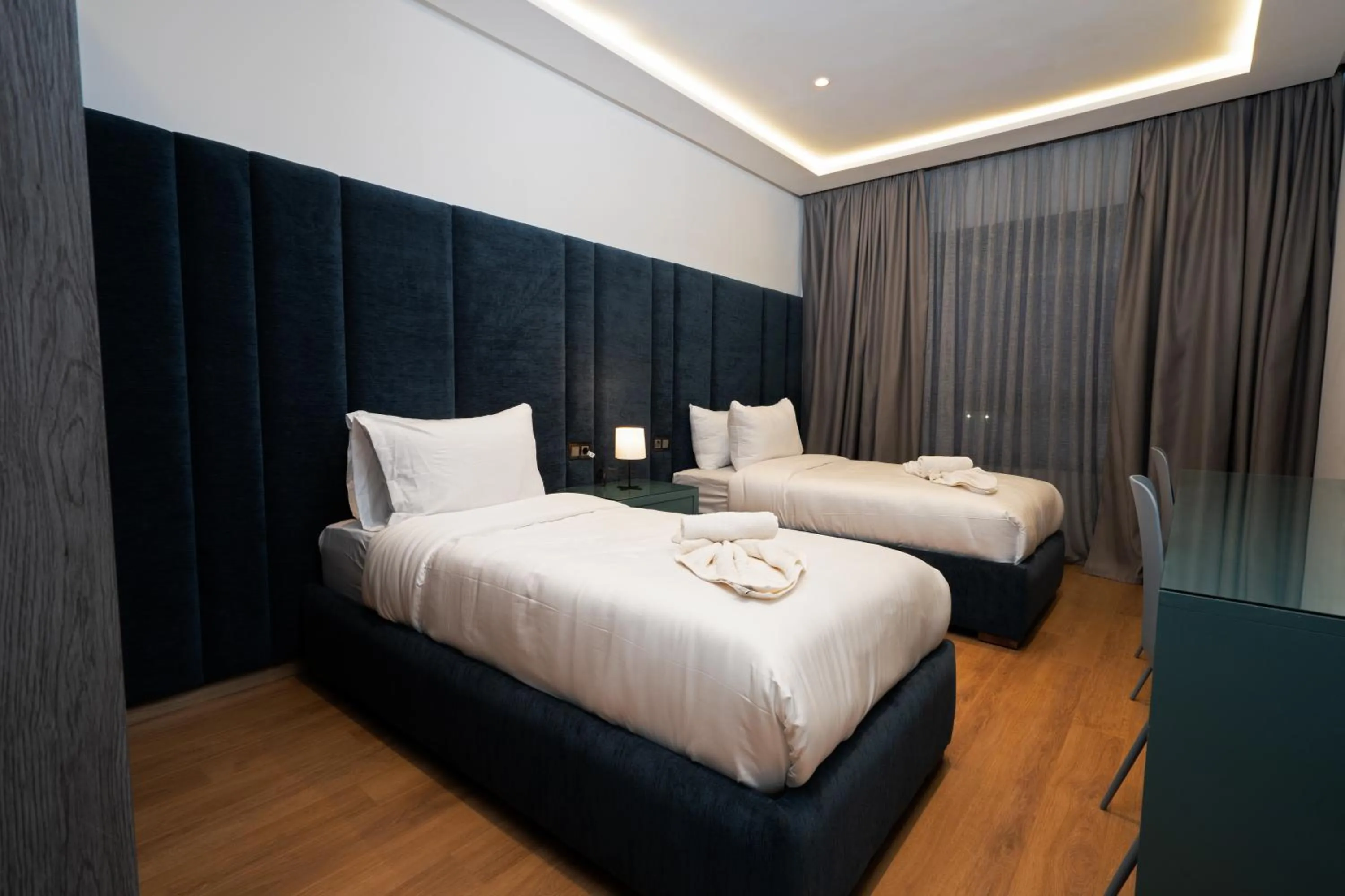 Bed in Amelia Appart-Hotel